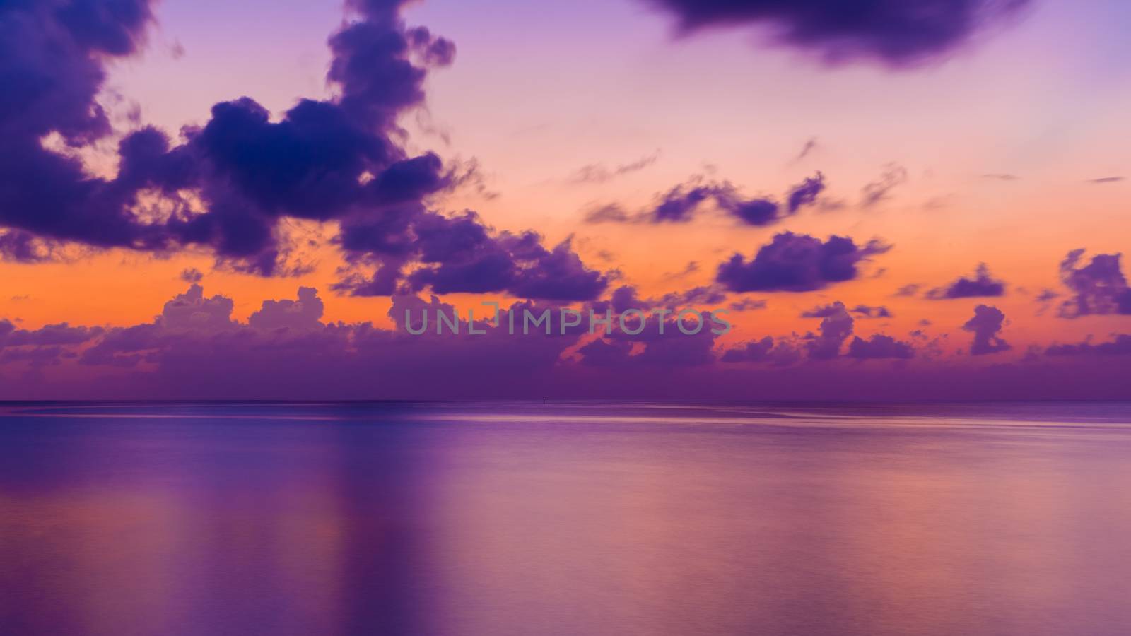 Sunset on the horizon in purple and orange.