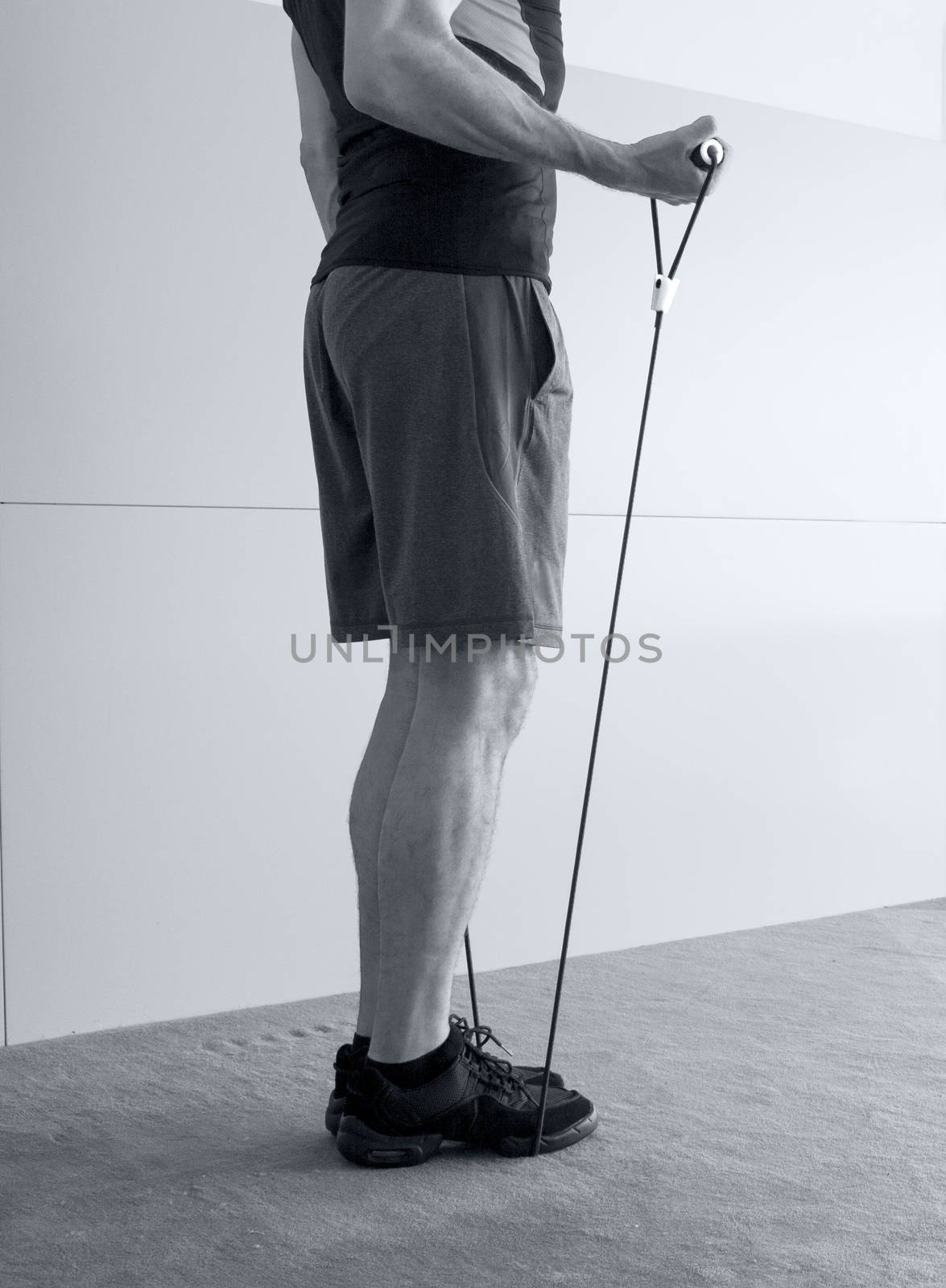 Man with resistance rope fitness by GemaIbarra