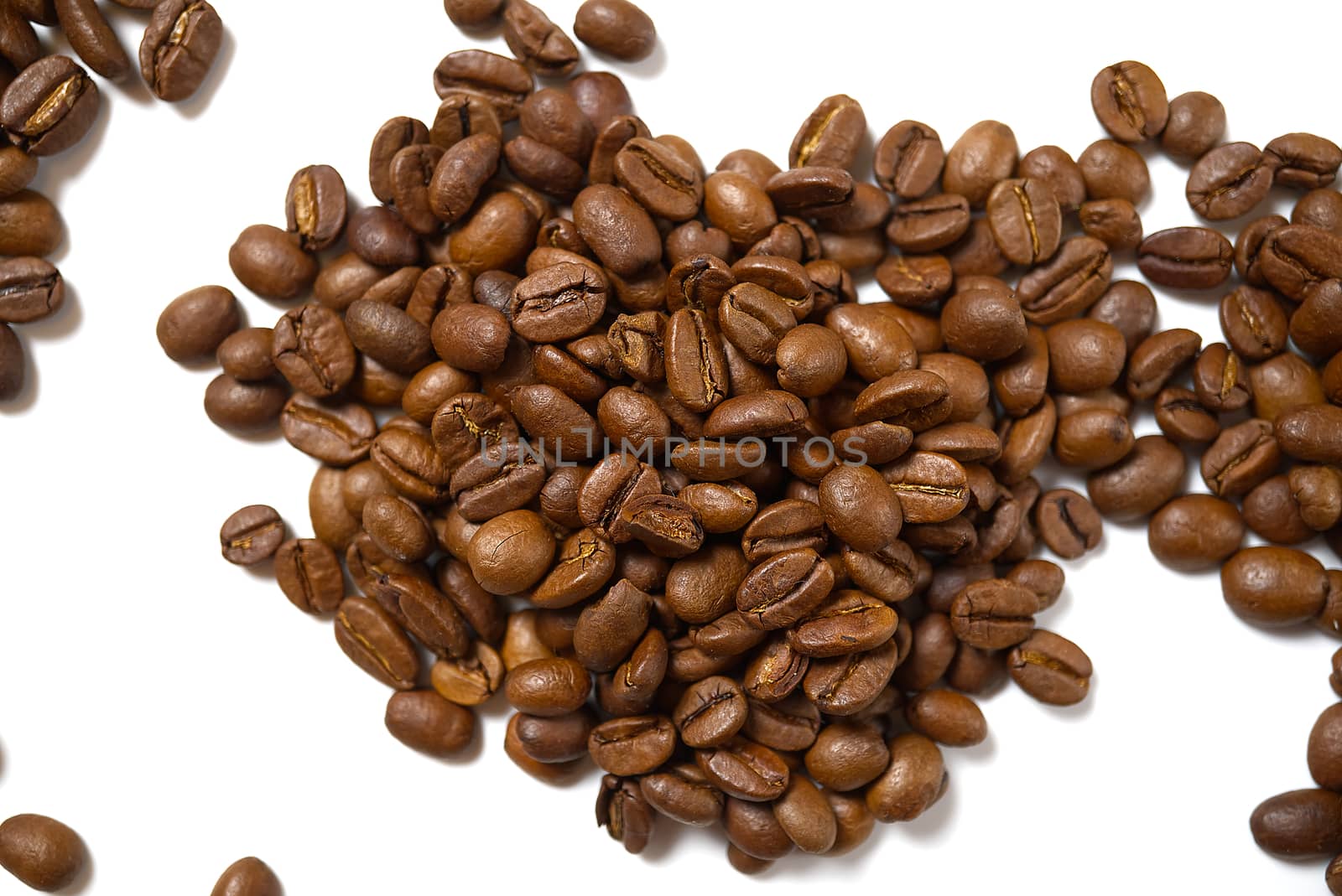 Pile of roasted coffee beans isolated in white background, by PhotoTime