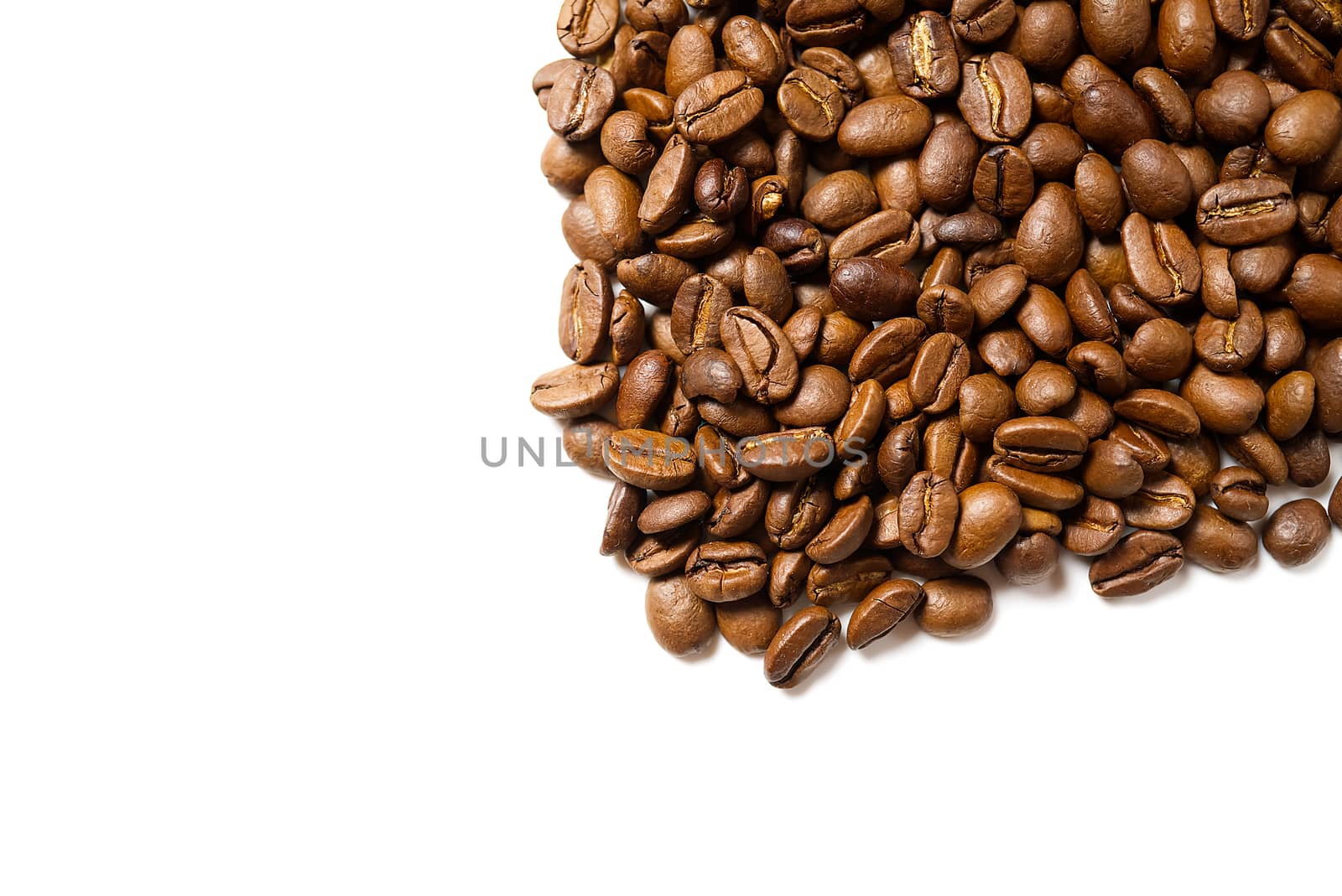Pile of roasted coffee beans isolated in white background, by PhotoTime
