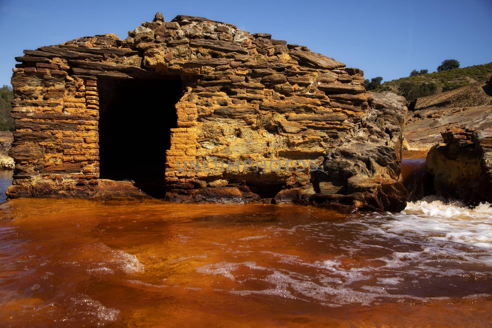 Beautiful house made out of stones in the middle of rio Tinto, Huelva.