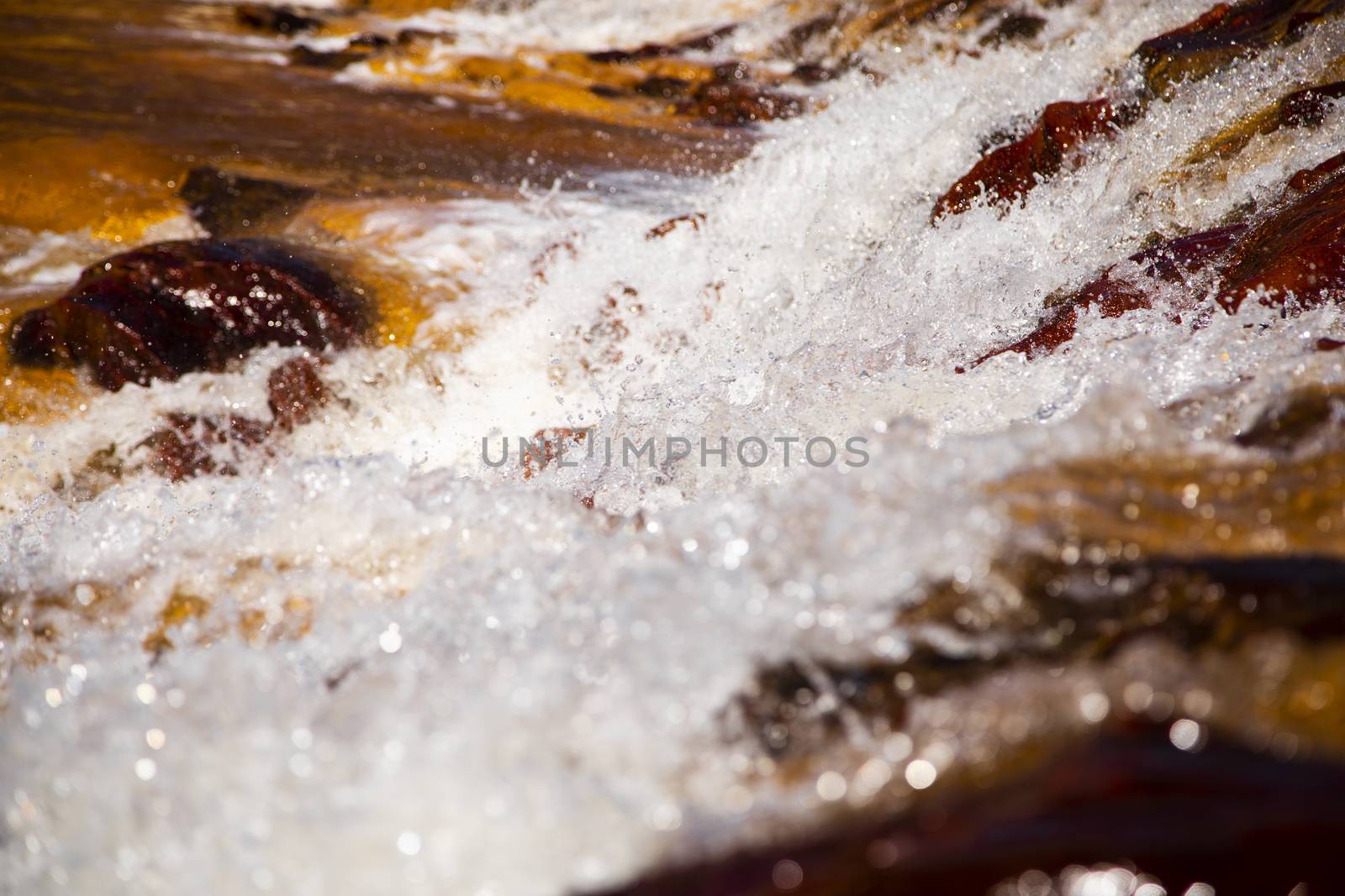 Beautiful landscape in Huelva, Rio Tinto, small cascade with water flowing