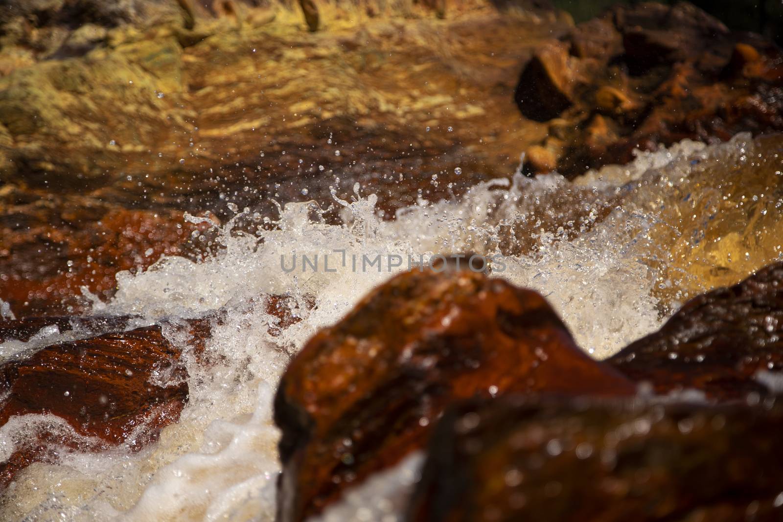 Beautiful landscape in Huelva, Rio Tinto, small cascade with water flowing