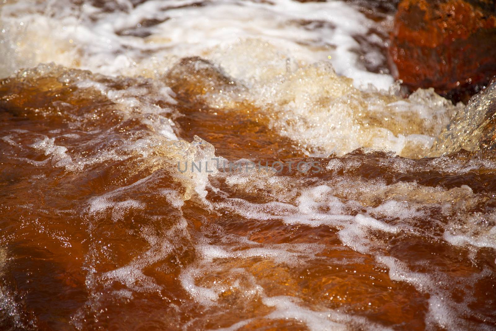 Beautiful landscape in Huelva, Rio Tinto, small cascade with water flowing