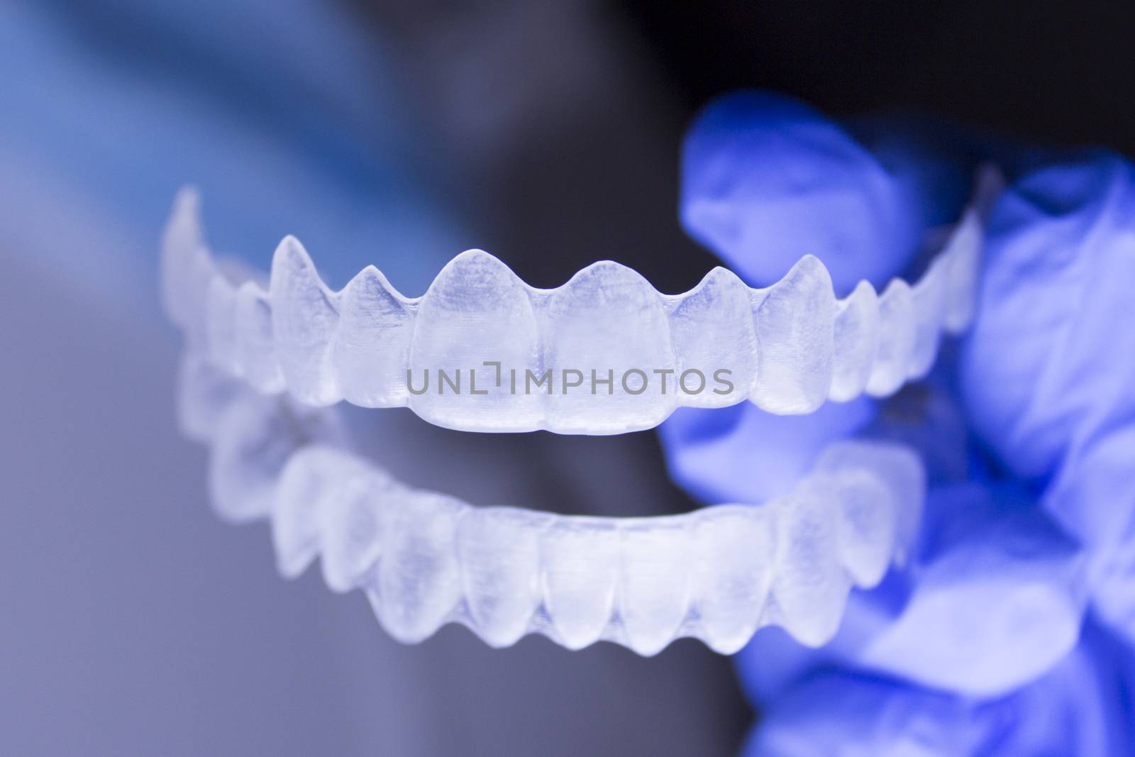 Dental orthodontics held by dentists hand by GemaIbarra