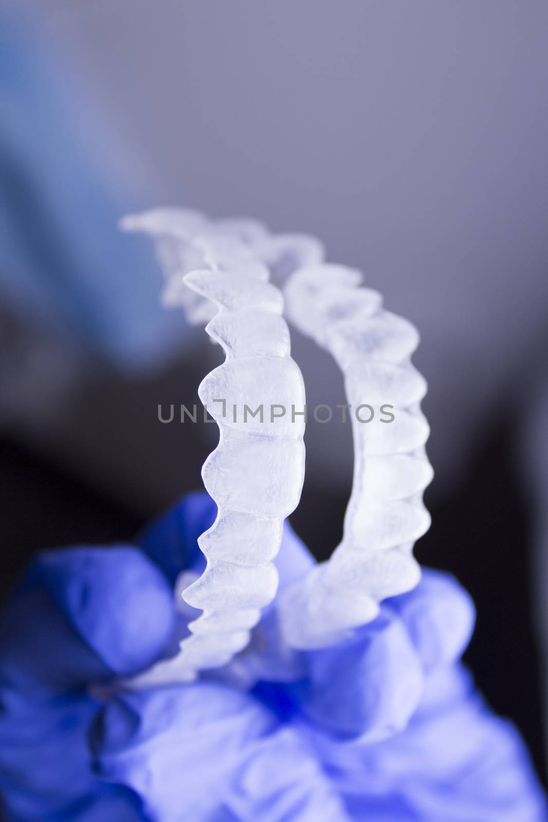 Dental orthodontics held by dentists hand by GemaIbarra