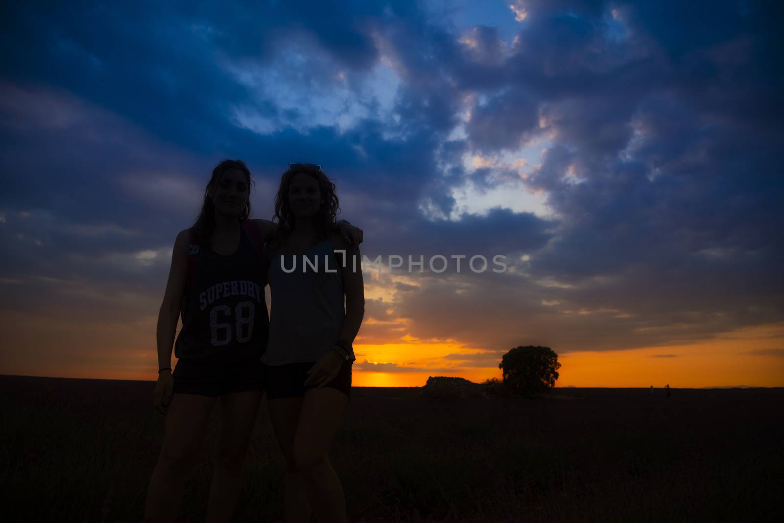 Two friends in a lavender field in July.