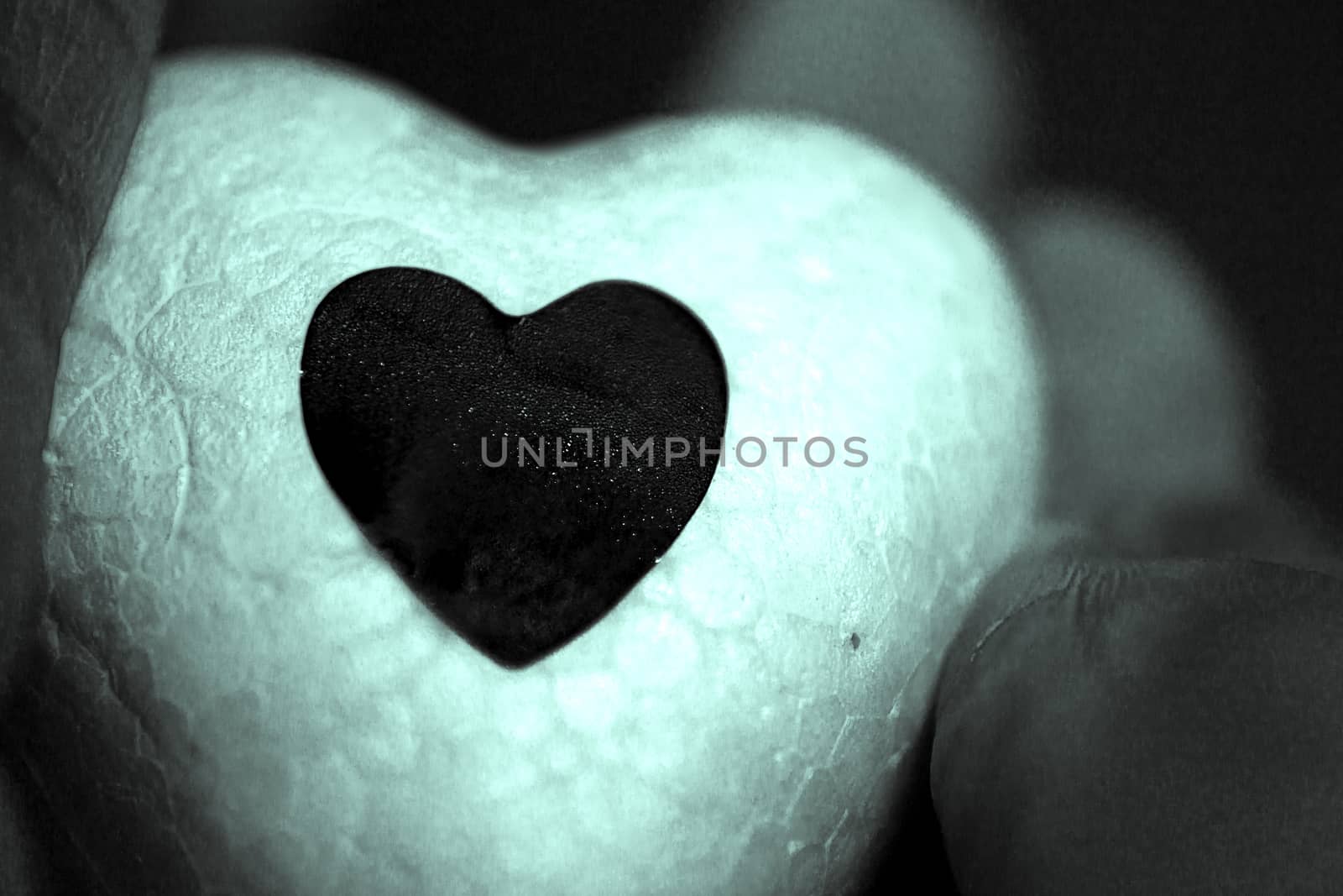 White heart made of polystyrene and bright black heart