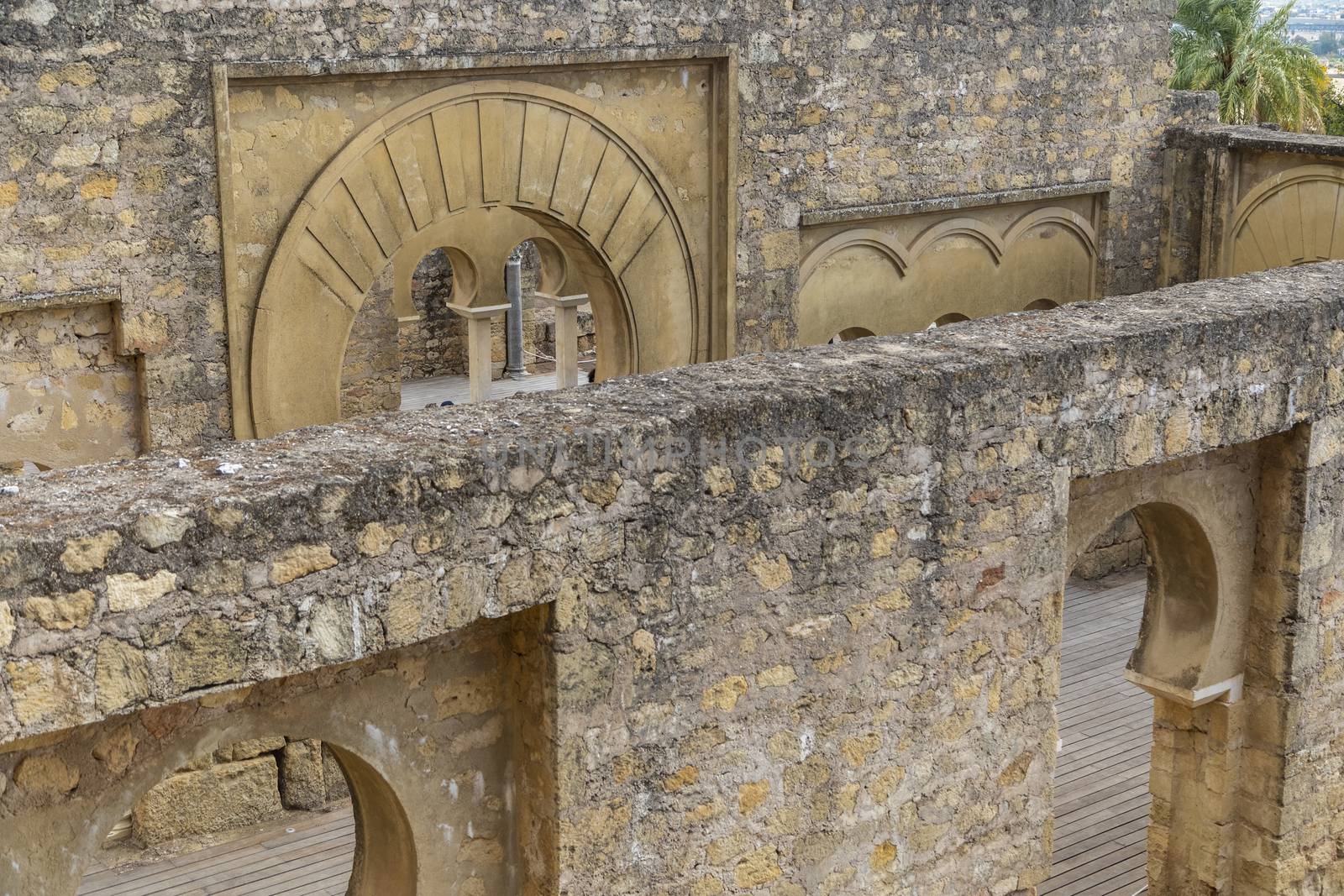 Cordoba, Spain -  November 1 2019: Fragment of wall with floral paterns in 10th century ruined Moorish medieval city Medina Azahara in Andalucia on November 1, 201. UNESCO world heritage site.