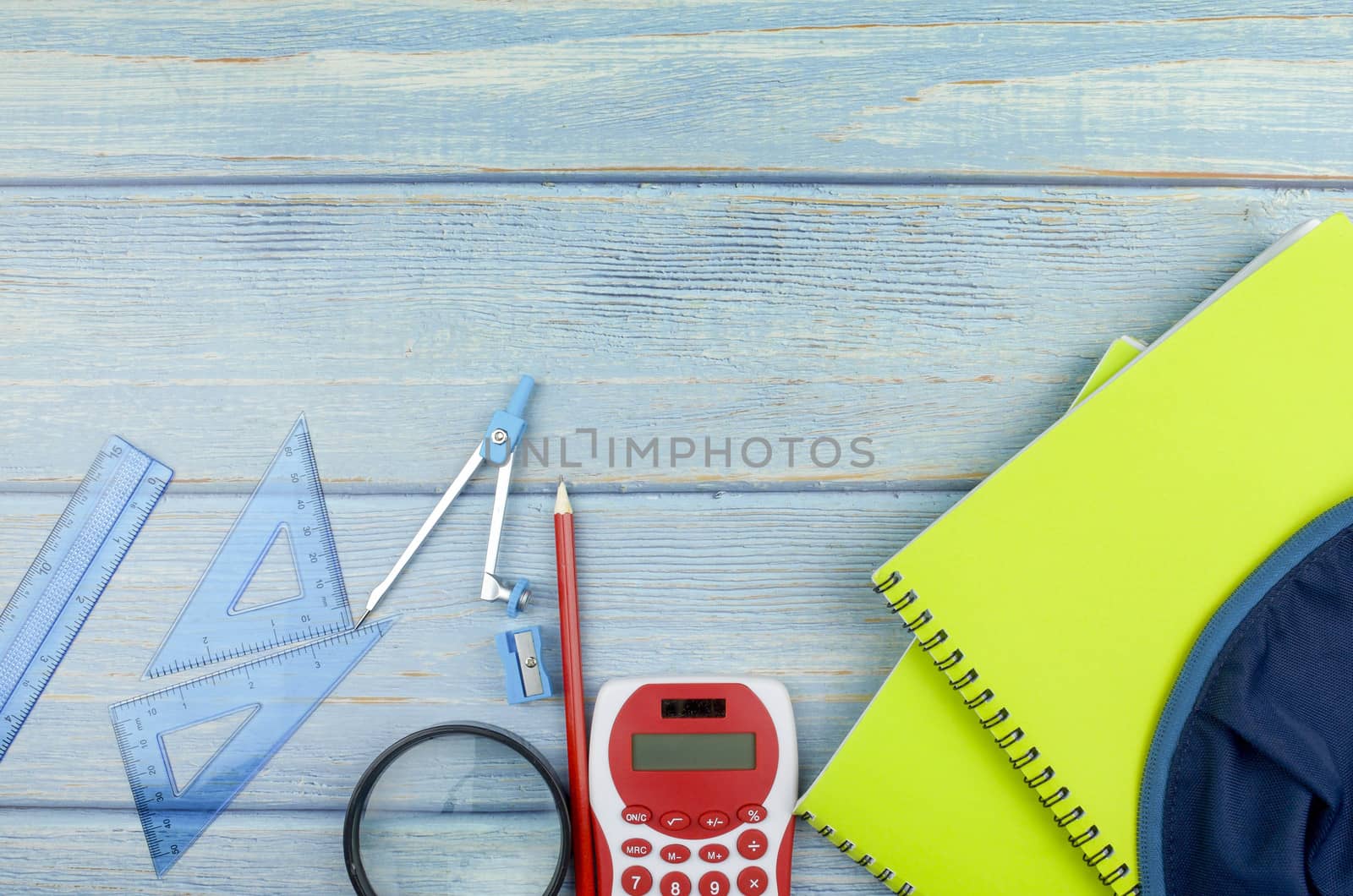 Student backpack and various school supplies, studing, education and back to school concept.