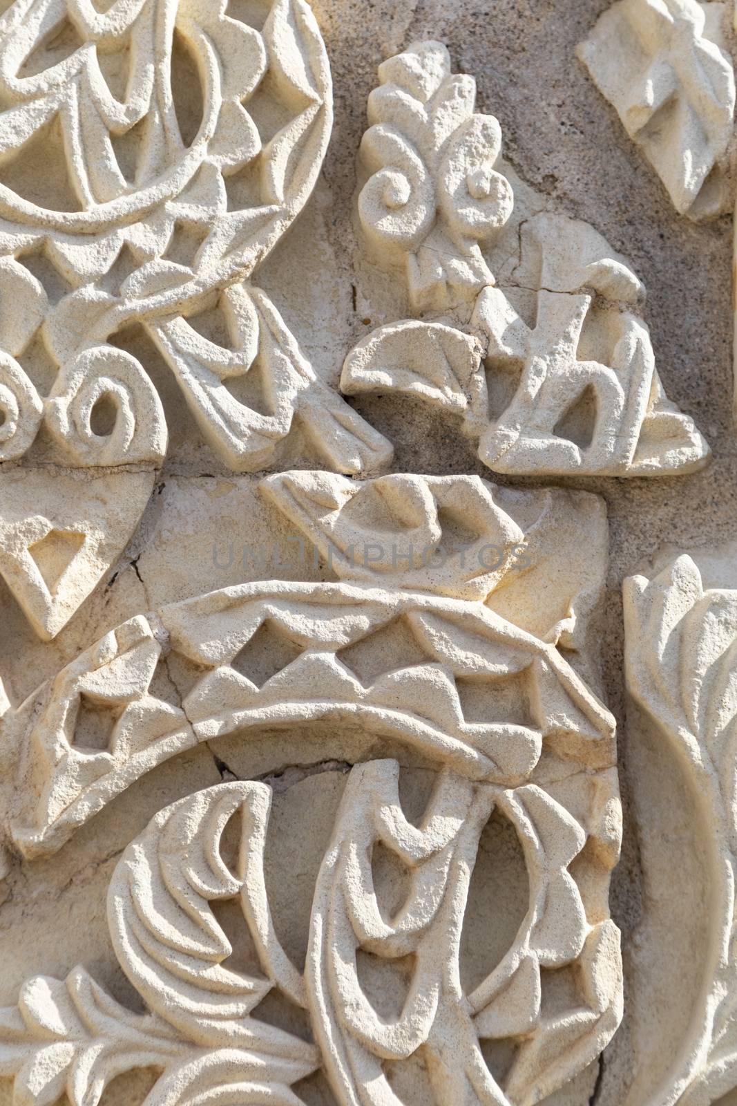 Fragment of wall with floral paterns in 10th century ruined Moorish medieval city Medina Azahara in Andalucia by Nemida