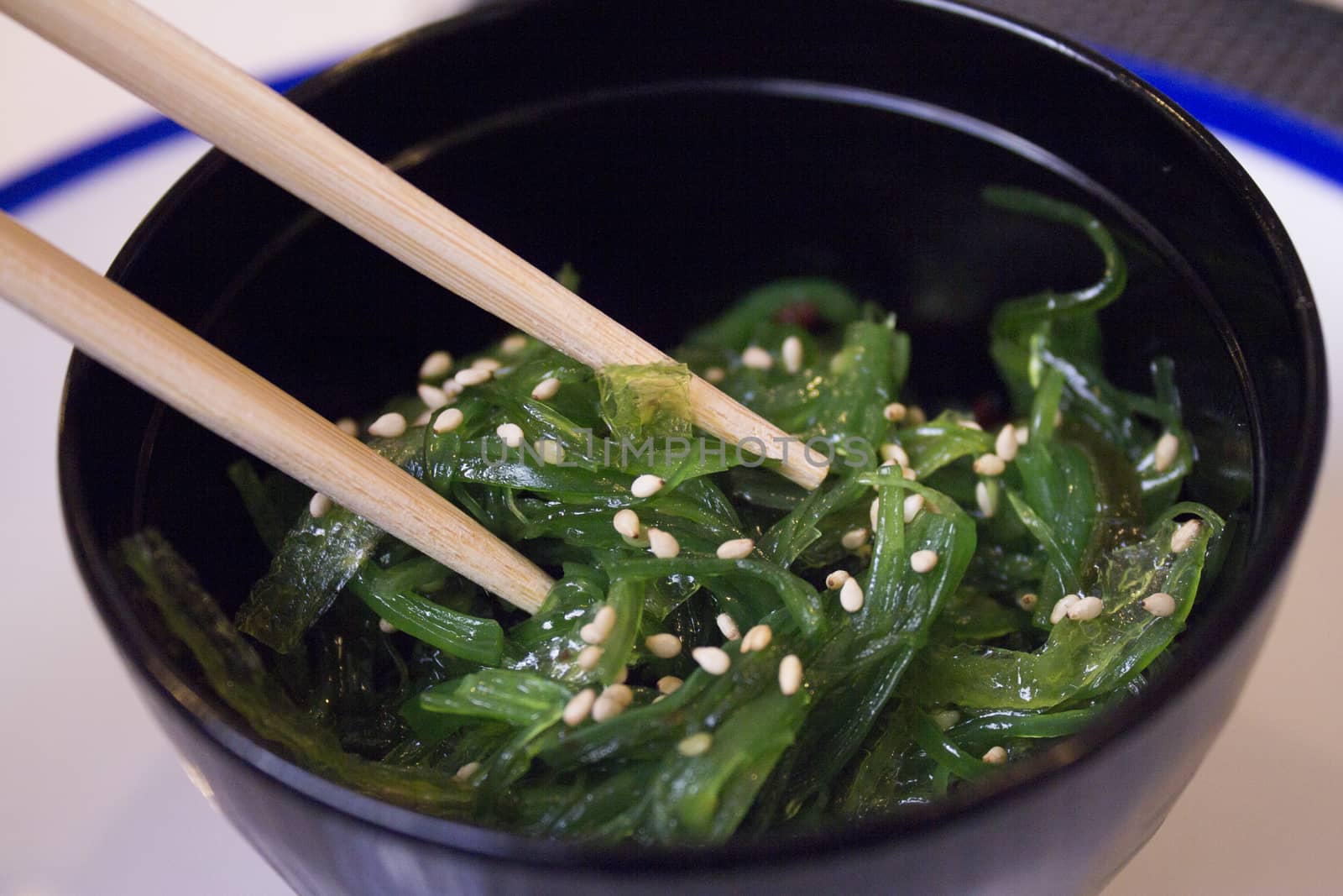 Container with wakame seaweed