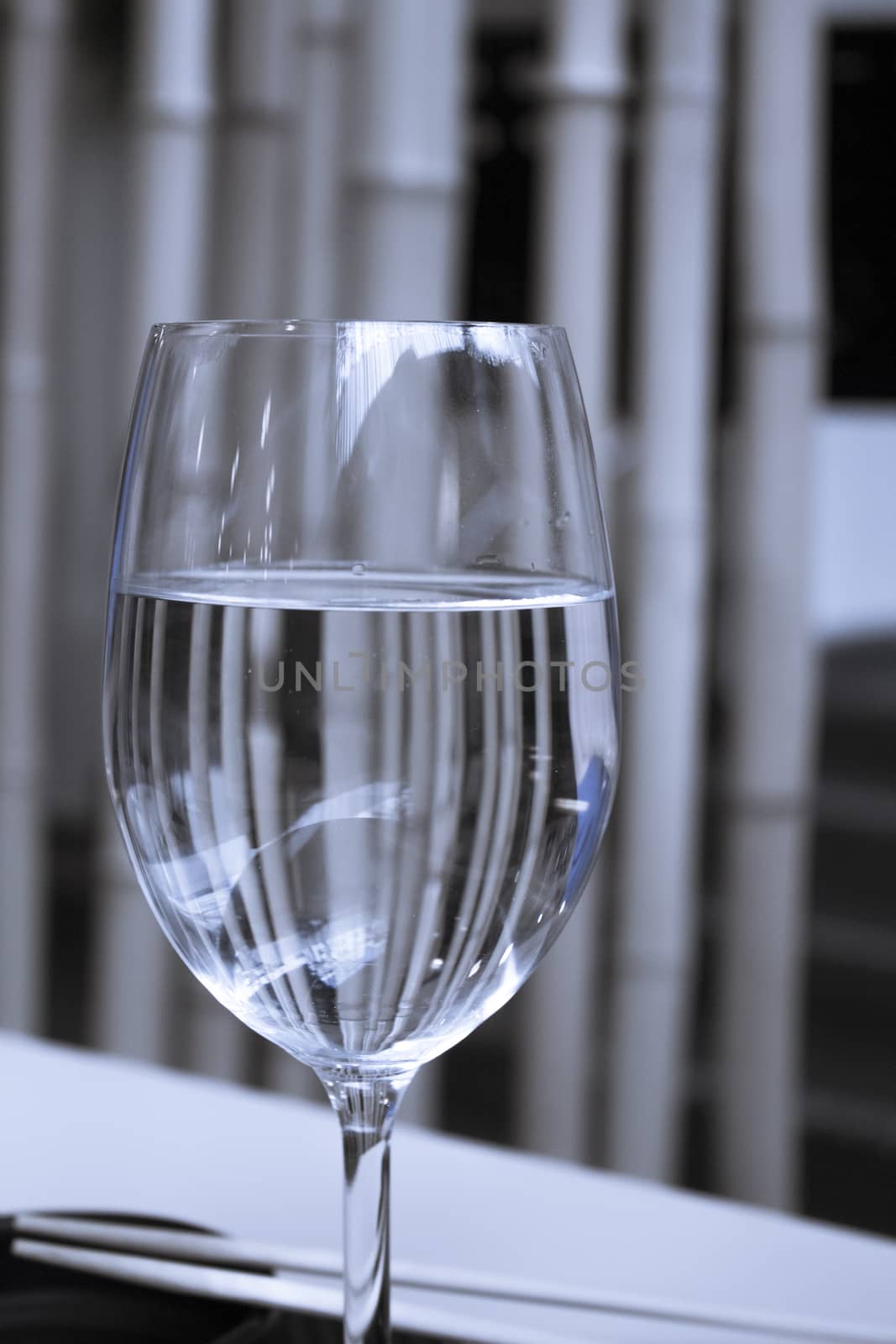 Glass of water resting on a restaurant table