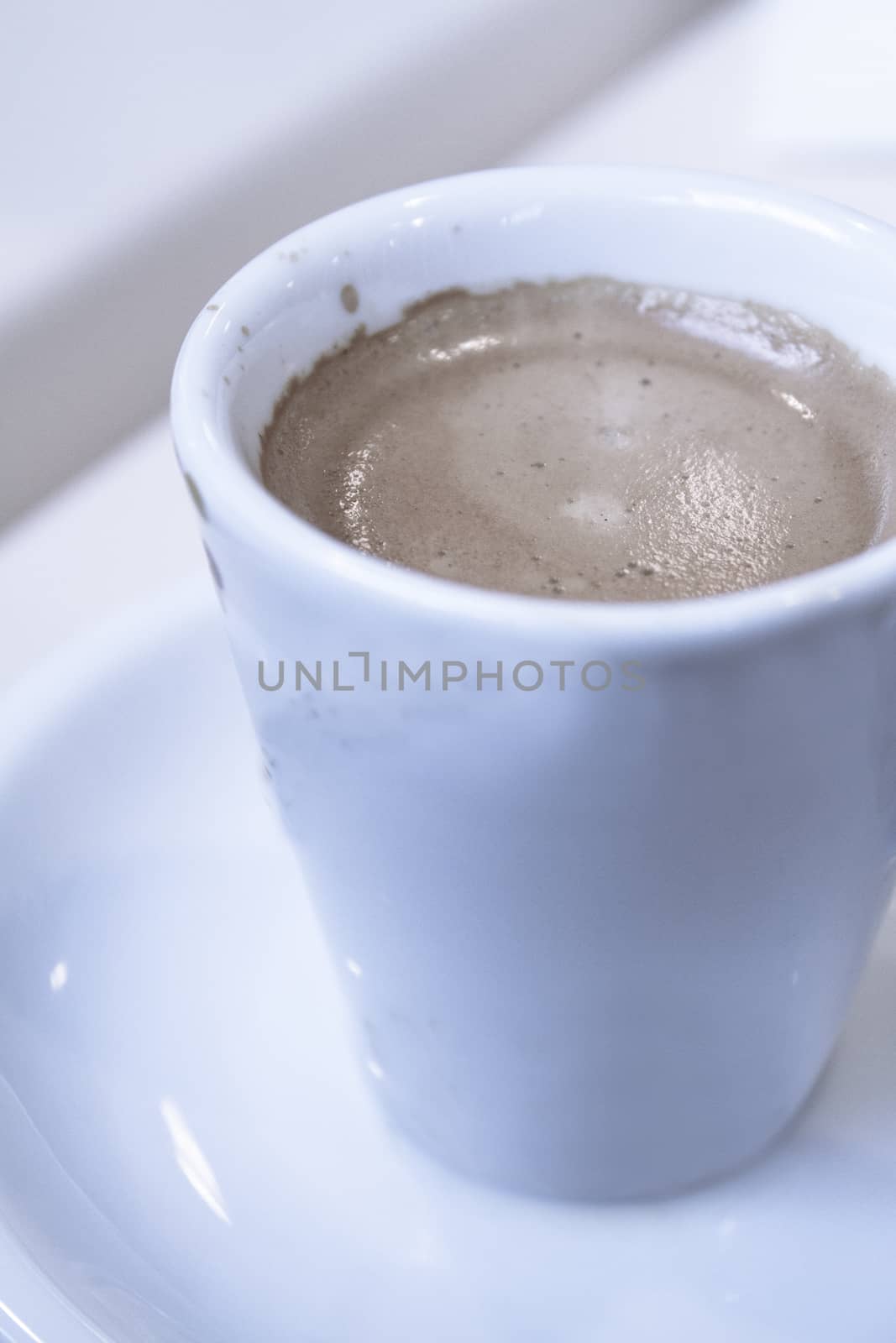 Hot coffee drink in a white cup