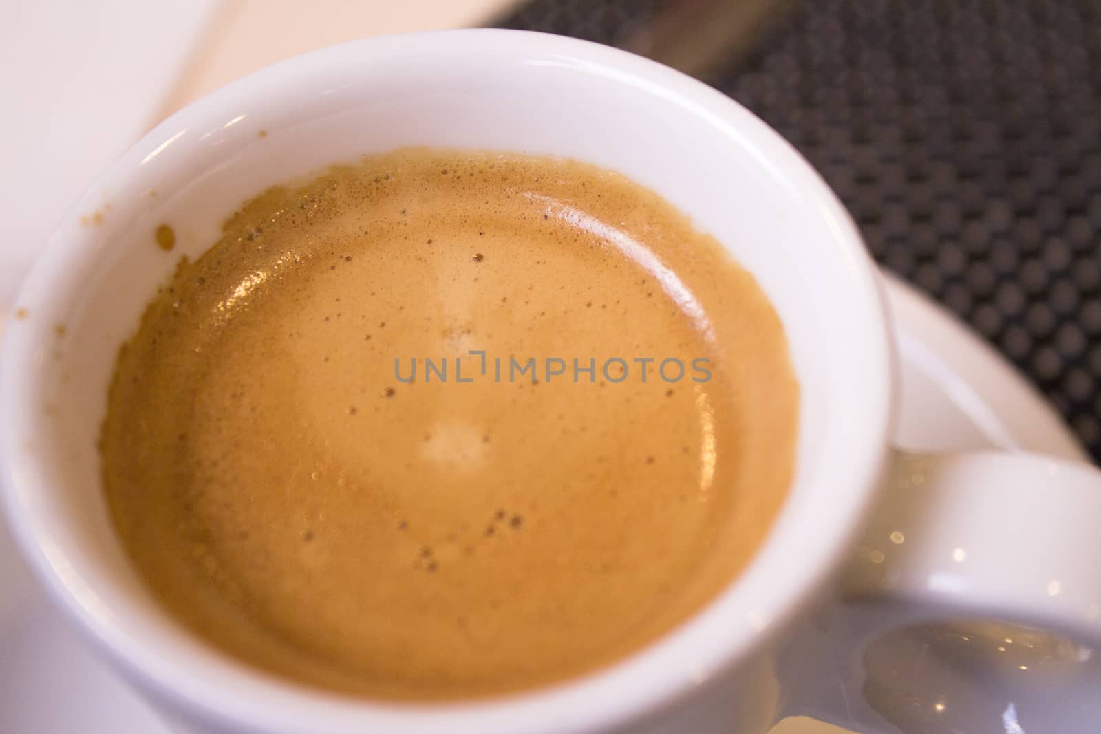 Hot coffee drink in a white cup