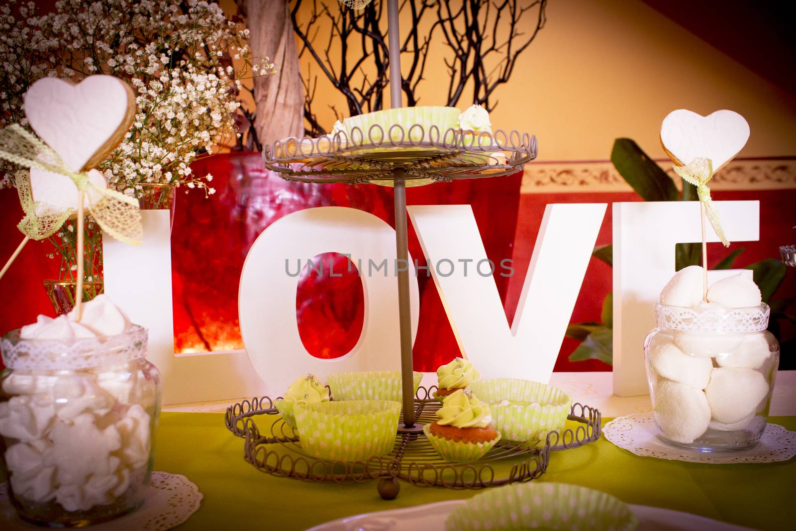 Wedding table with sweets and the word love