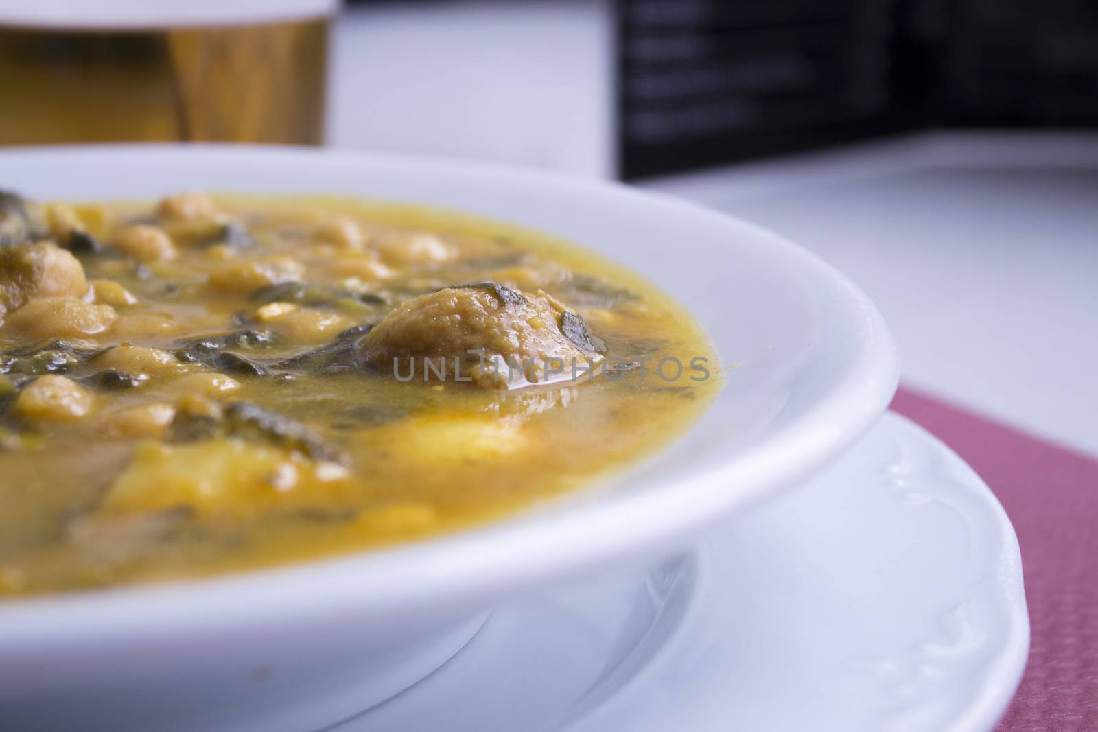 White dish with stew prepared for eating