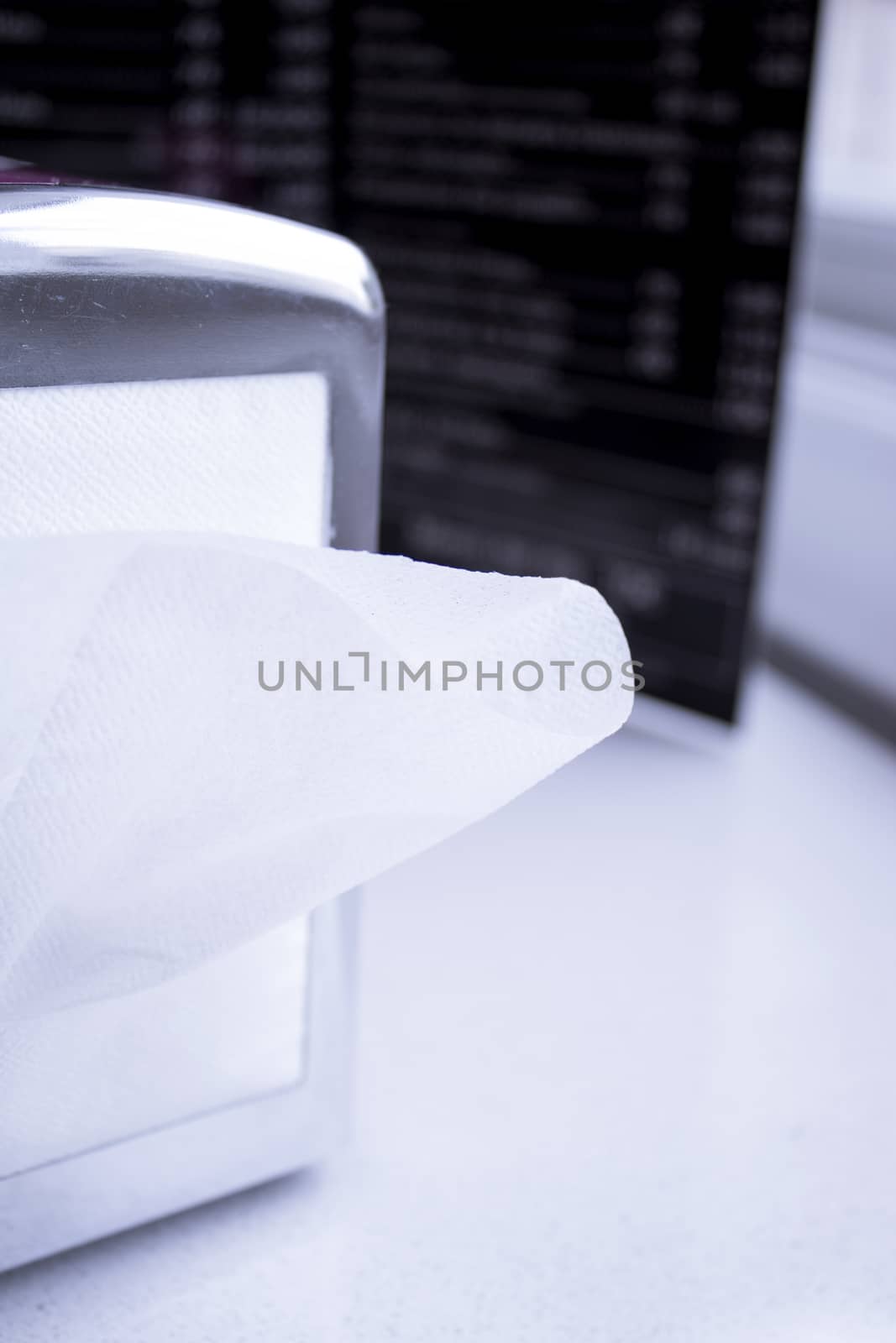 Napkin coming out of a napkin maker