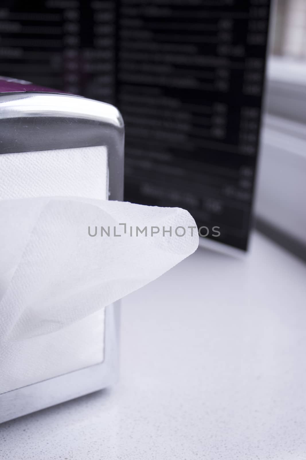 Napkin coming out of a napkin maker