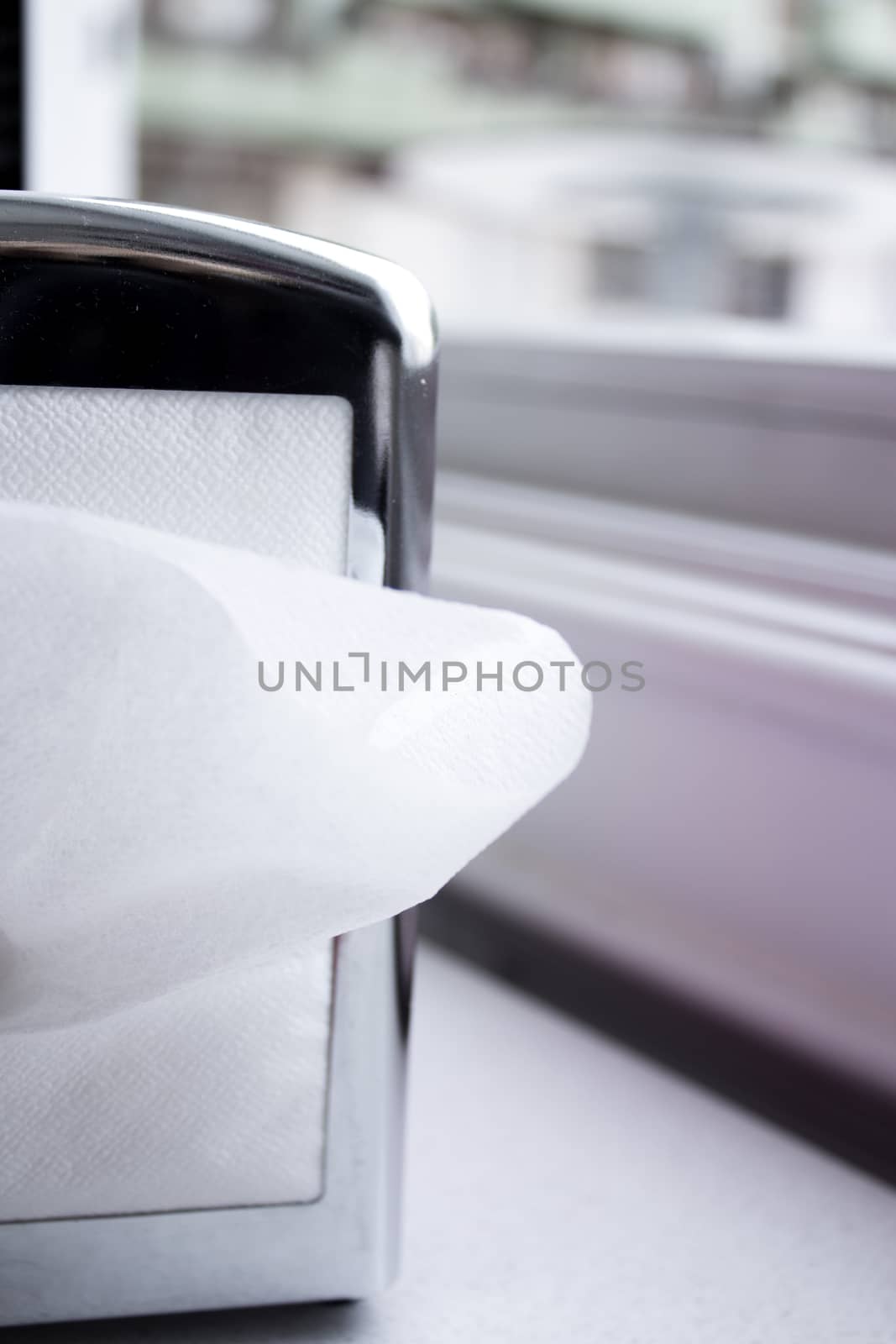 Napkin coming out of a napkin maker