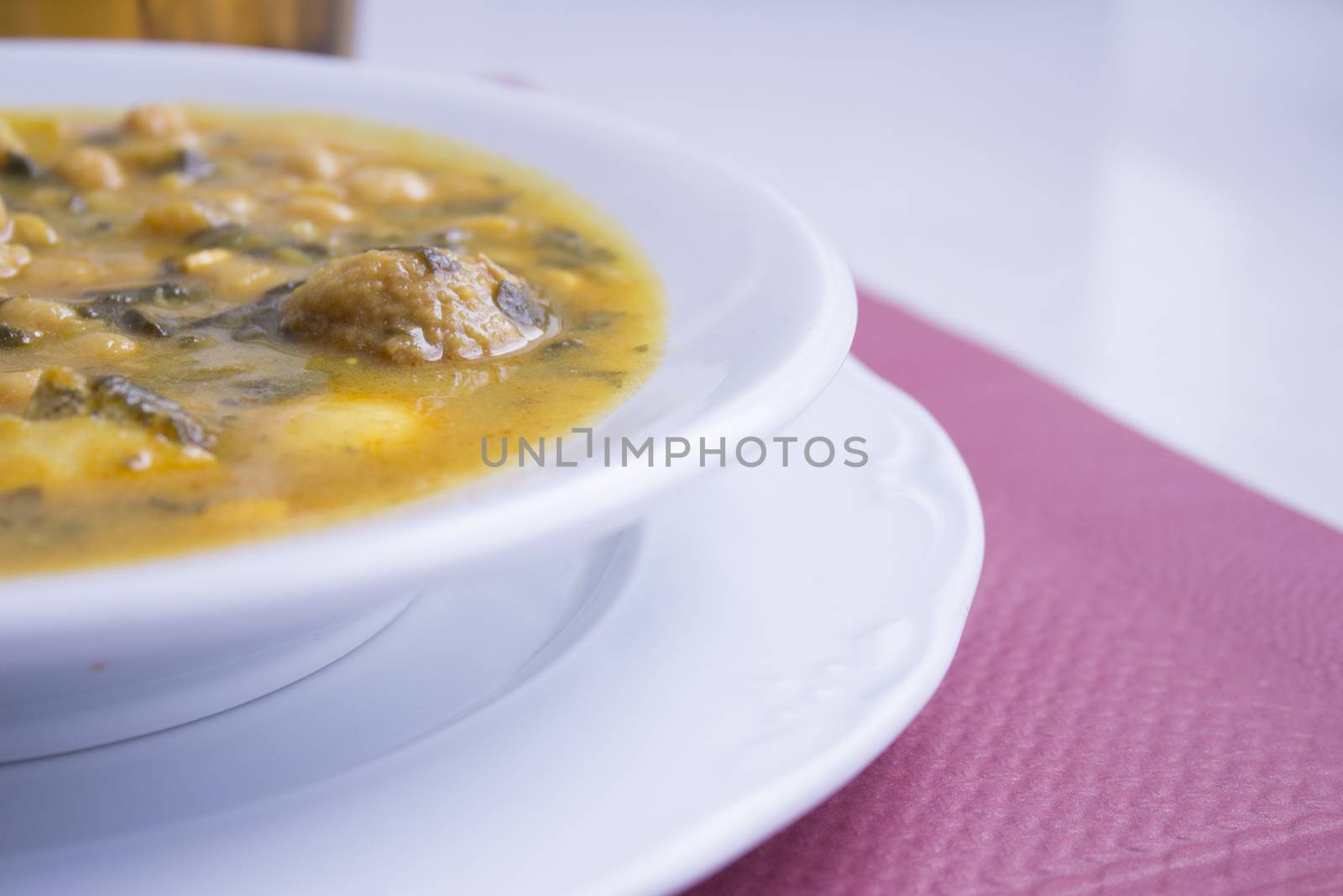 White dish with stew prepared for eating