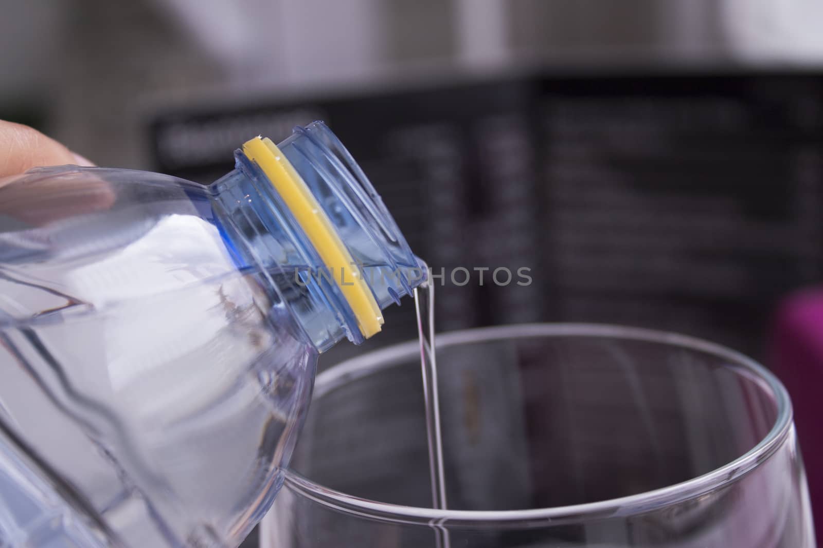 Open water bottle to serve in a glass