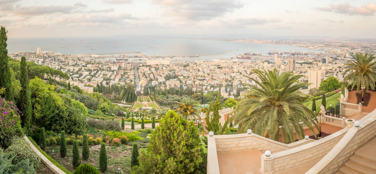 Panoramic view of the bay of Haifa, the Bahai Gardens and the port at sunset. Haifa, Israel