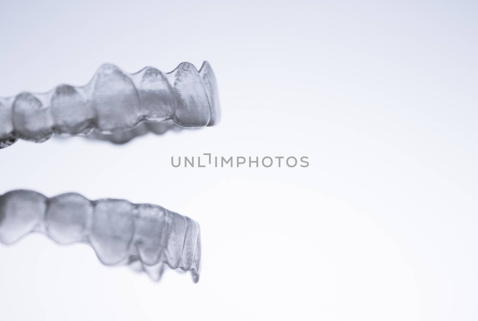 Invisible orthodontics for aligning teeth