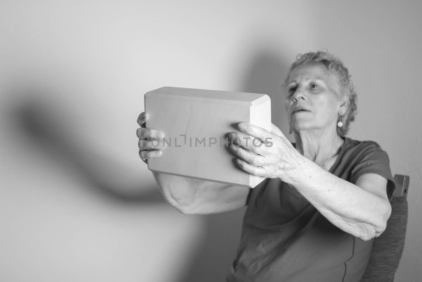 Rehabilitation for elderly woman with cerebral stroke with yoga exercises