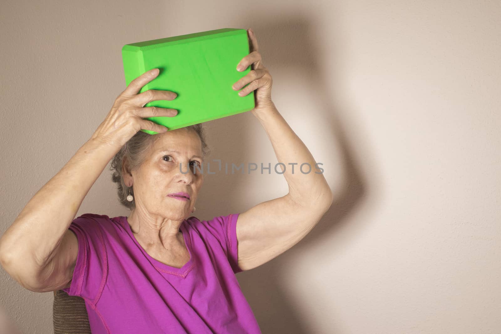 Rehabilitation for elderly woman with cerebral stroke with yoga exercises