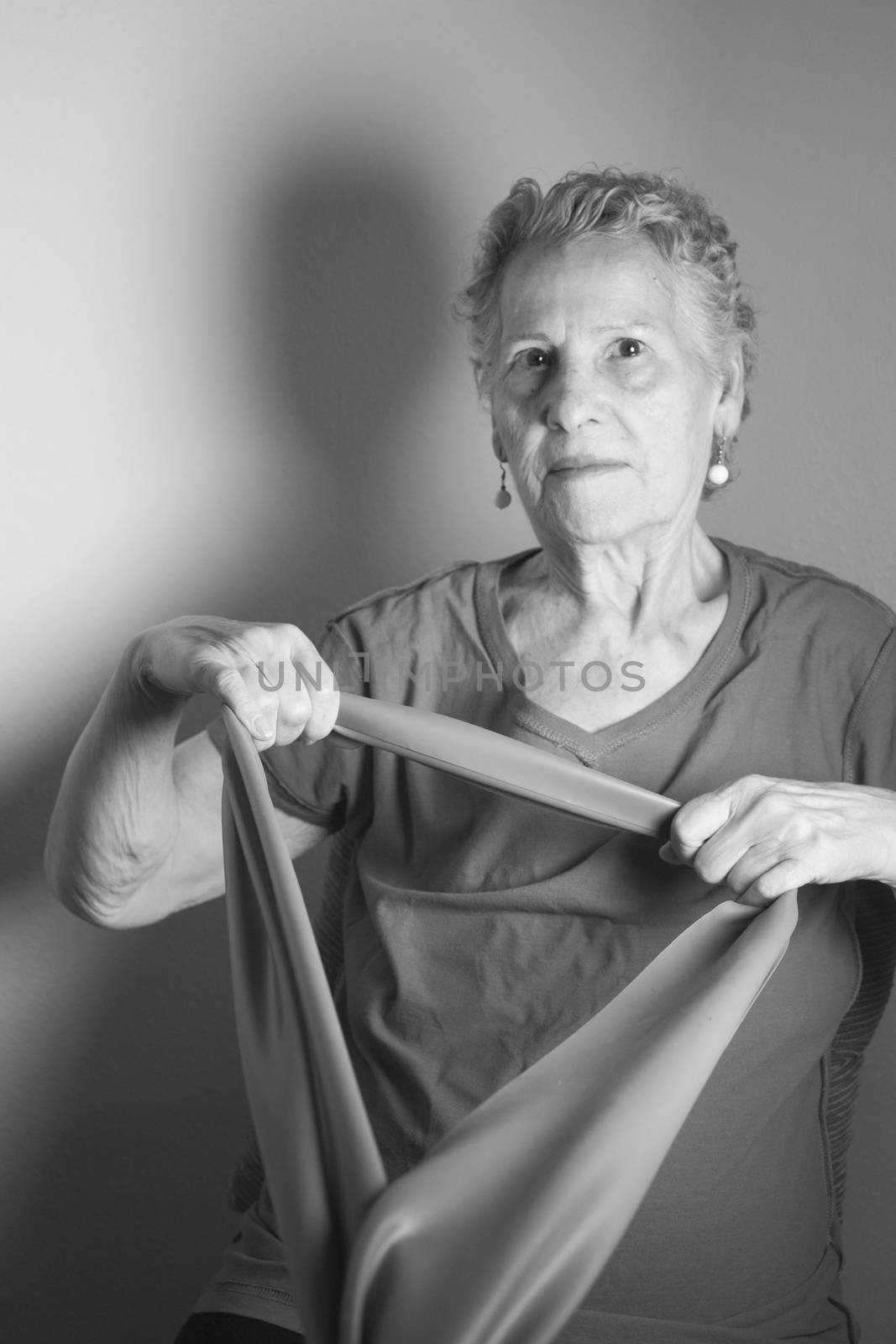 Rehabilitation exercises for older women with elastic band