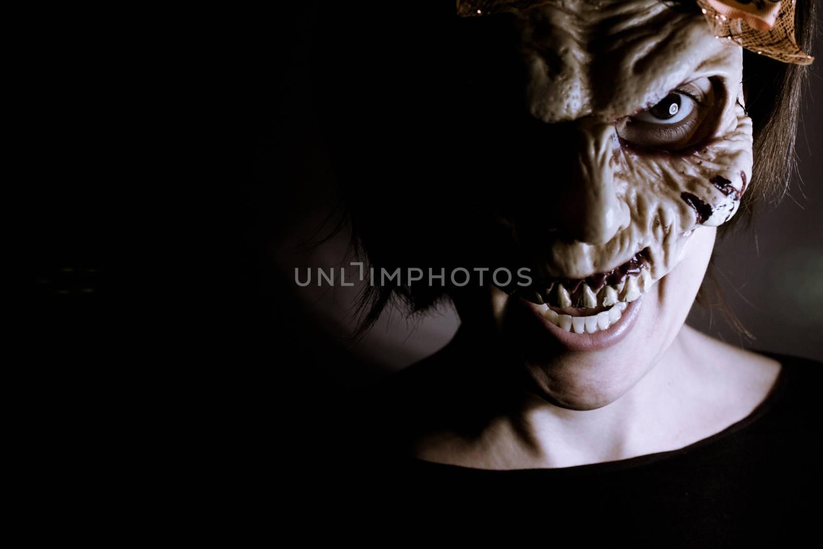 Portrait of a zombie woman at halloween party