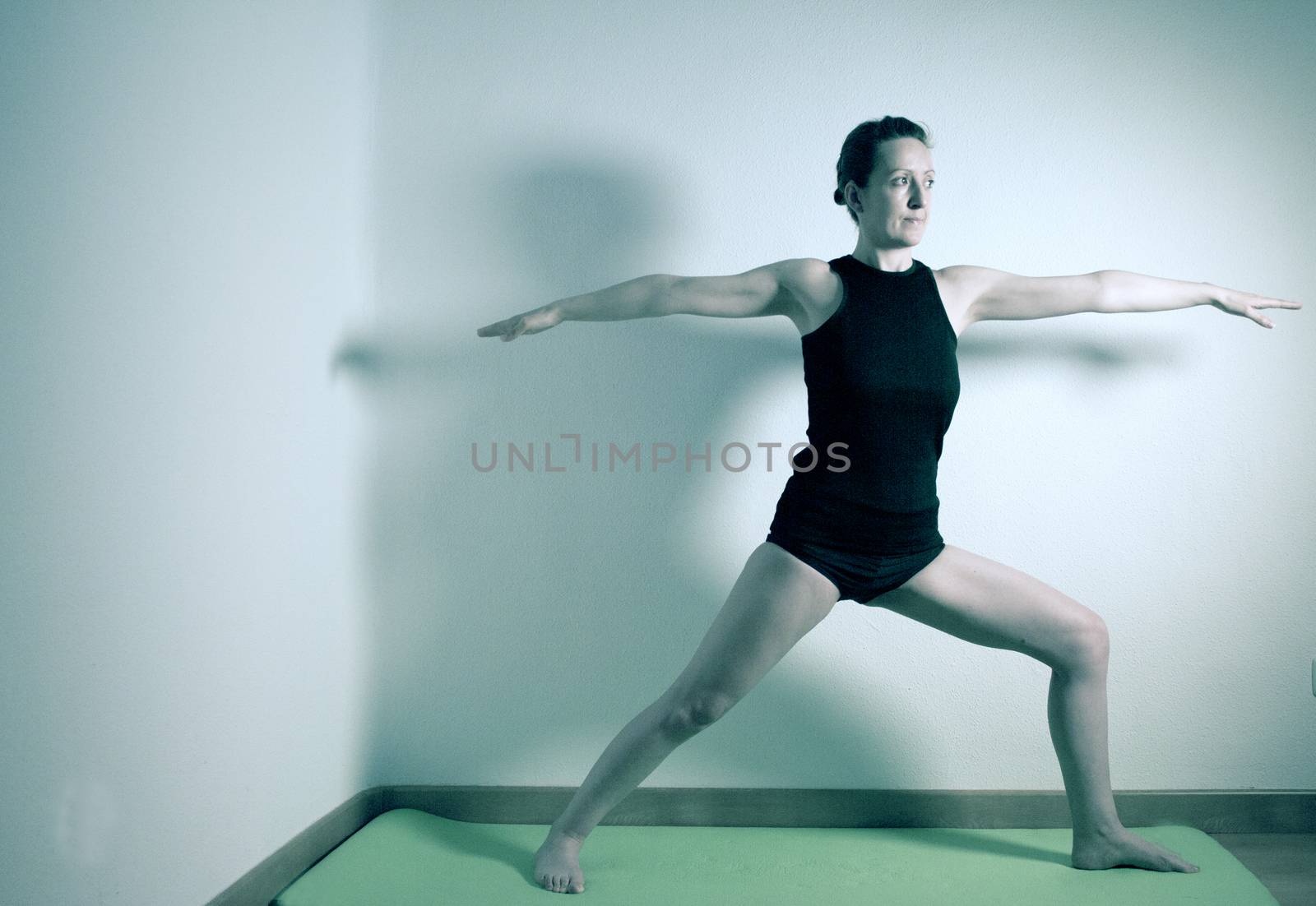 Individual yoga practice performed by a woman