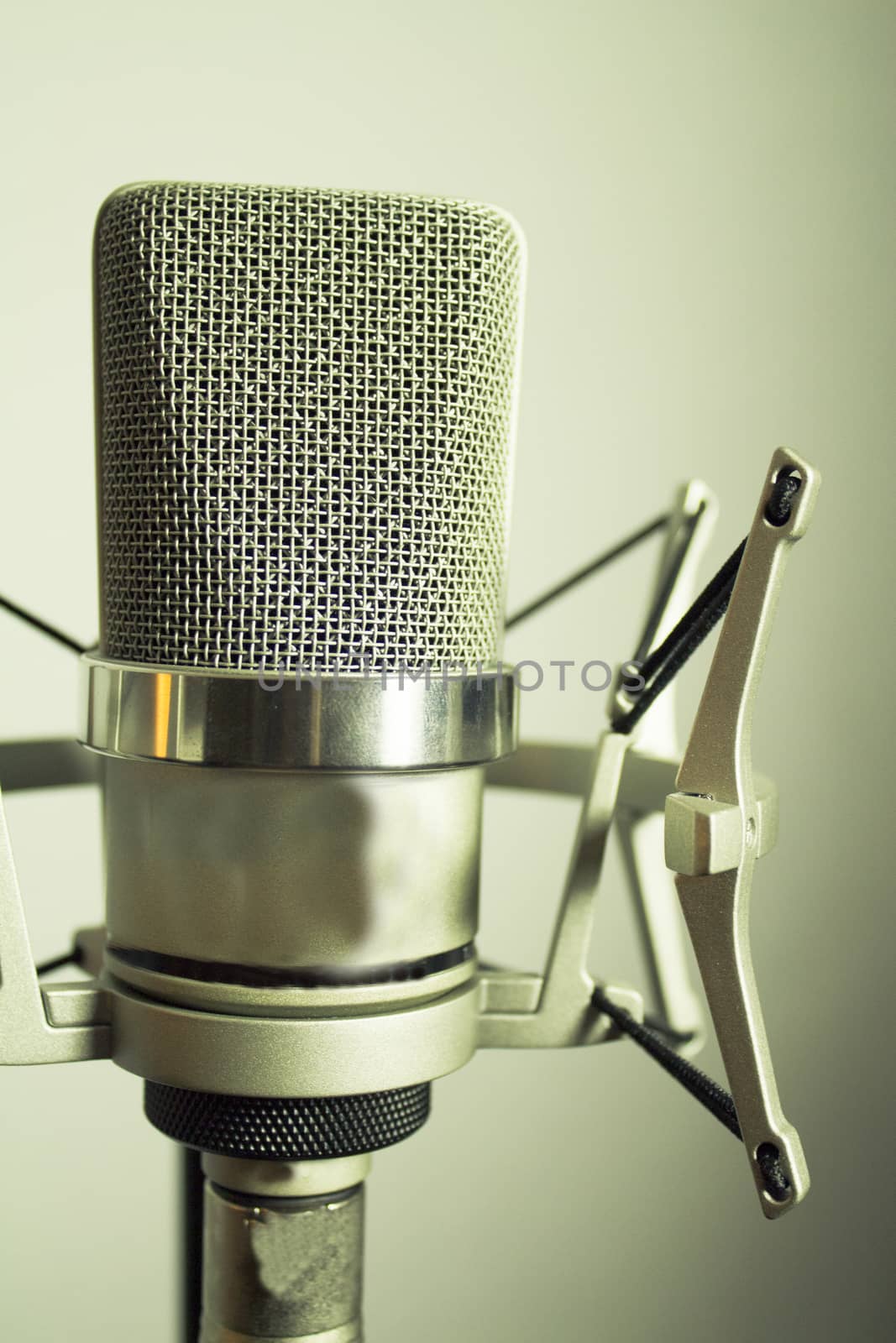 Professional microphone silver on white background