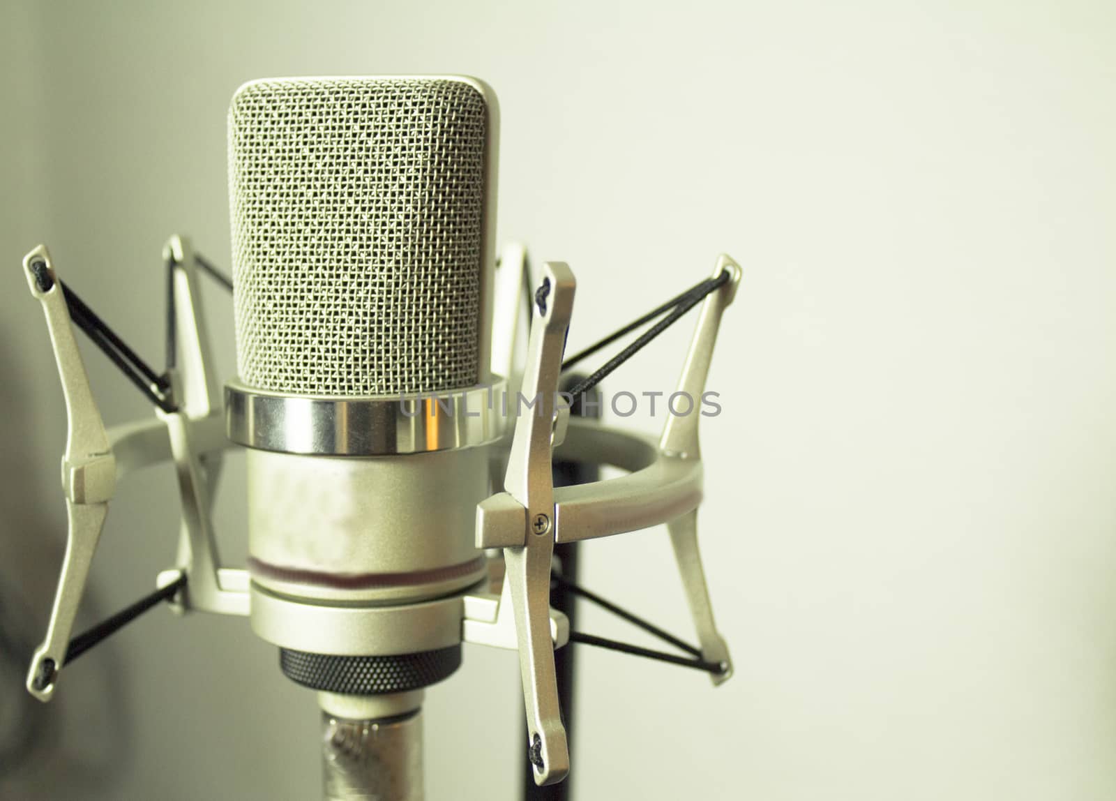 Professional microphone silver on white background