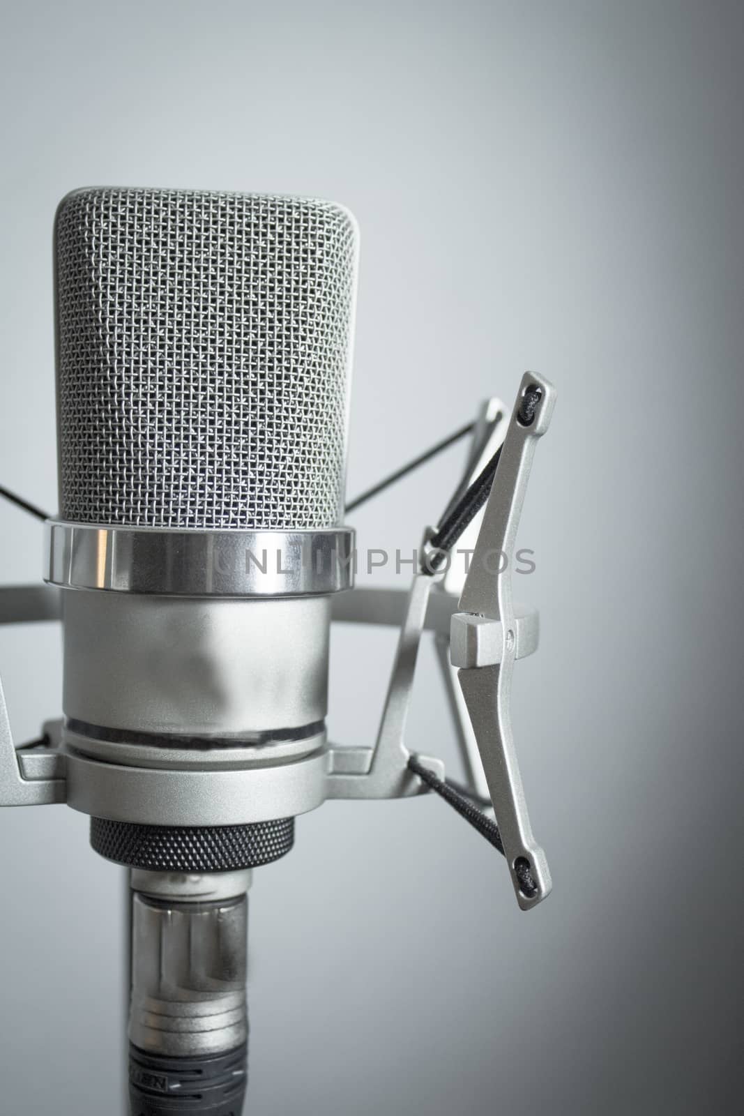 Professional microphone silver on white background