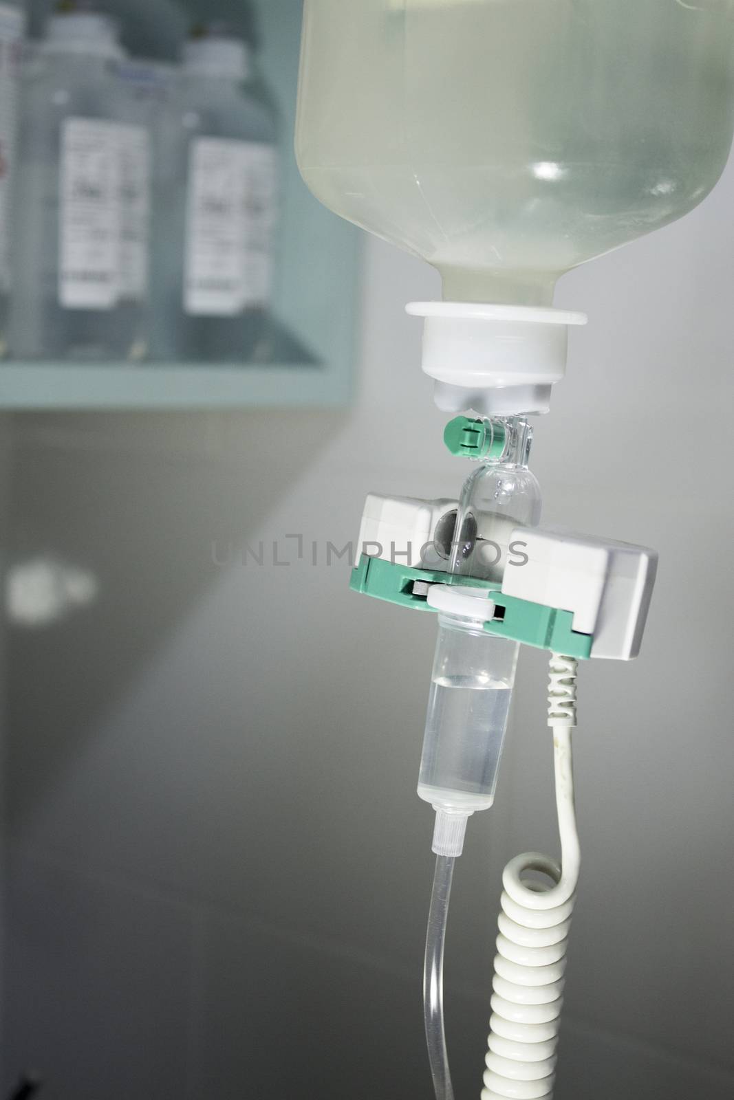 Plastic bottle of serum in surgical operation