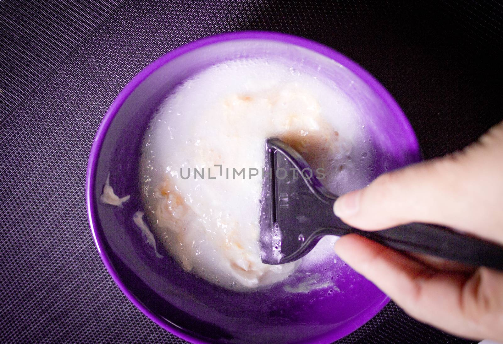 Woman removing hair dye mixture