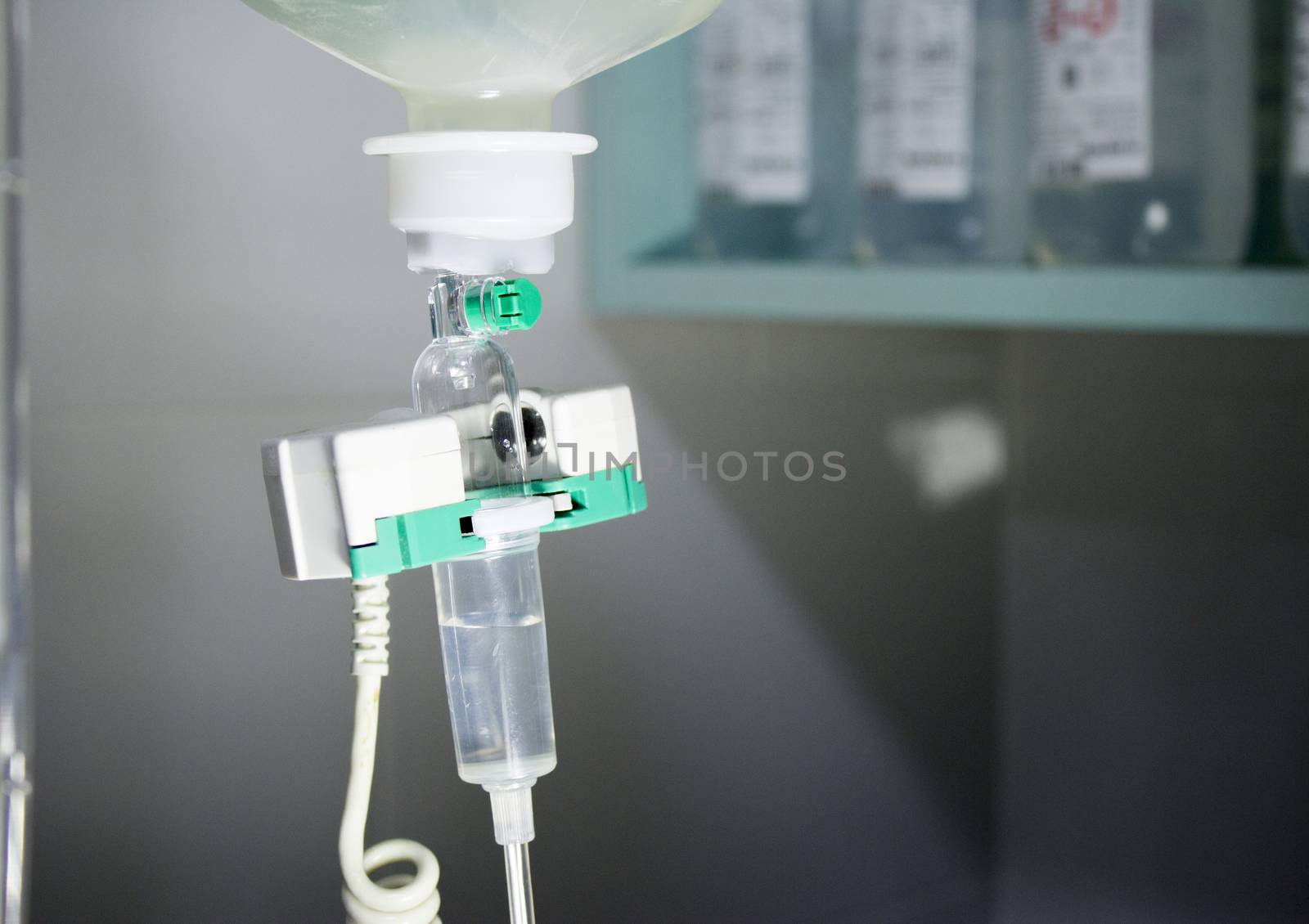 Plastic bottle of serum in surgical operation