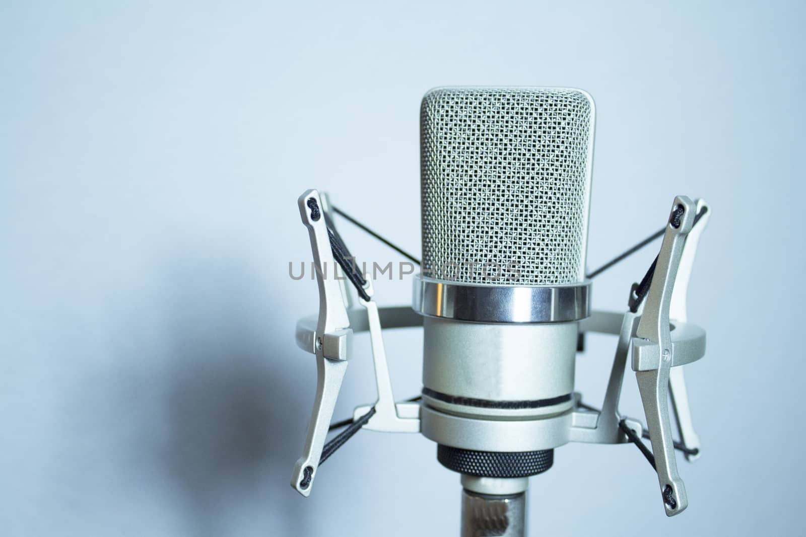 Professional microphone silver on white background