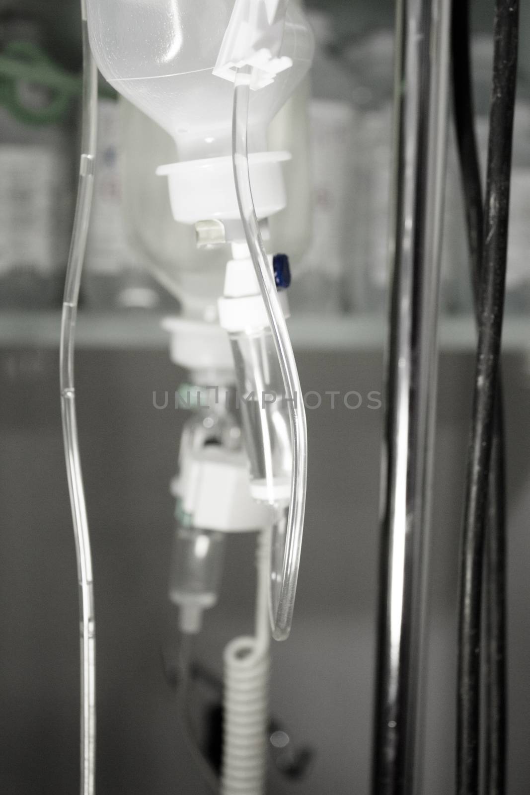 Plastic bottle of serum in surgical operation