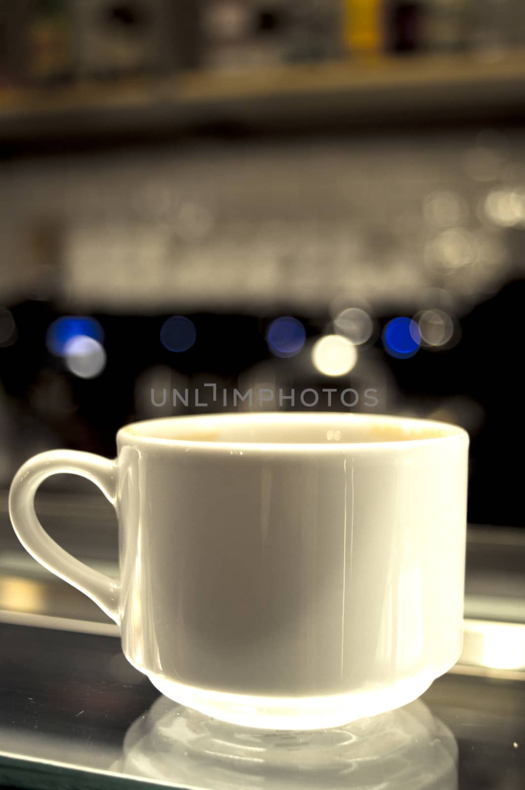 Whhite coffee cups on glass counter