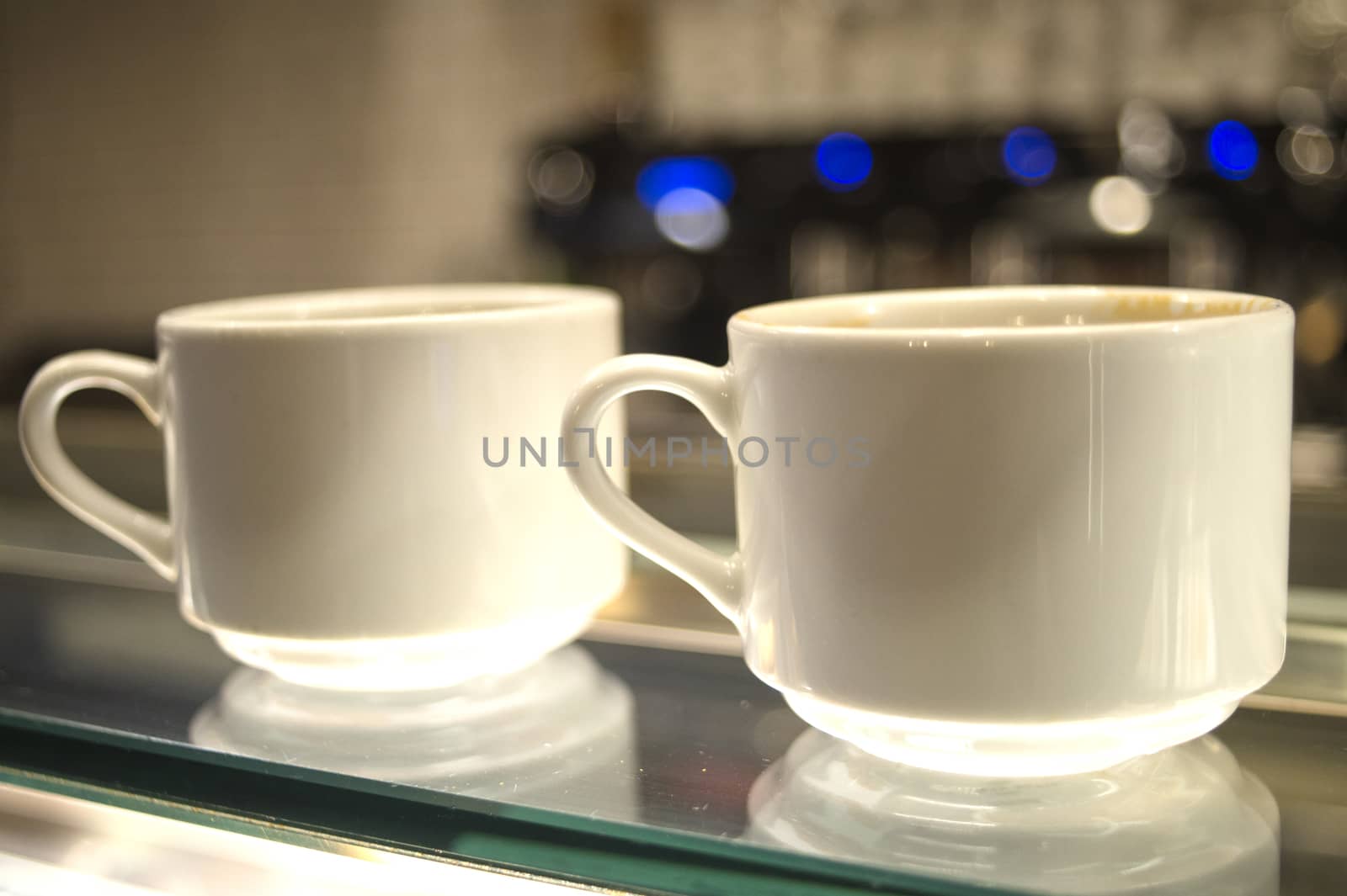 Whhite coffee cups on glass counter