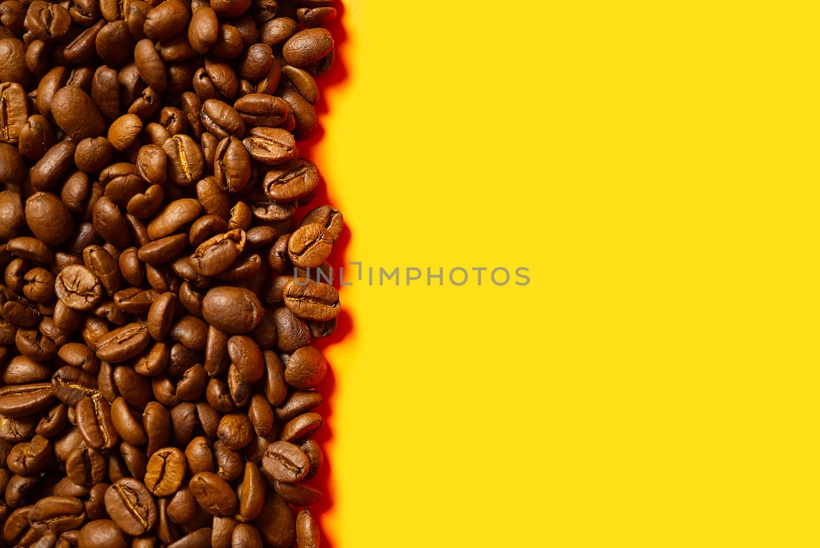 Texture of coffee beans. Roasted coffee beans background. close up Coffee beans with copy space on Orange background. by PhotoTime