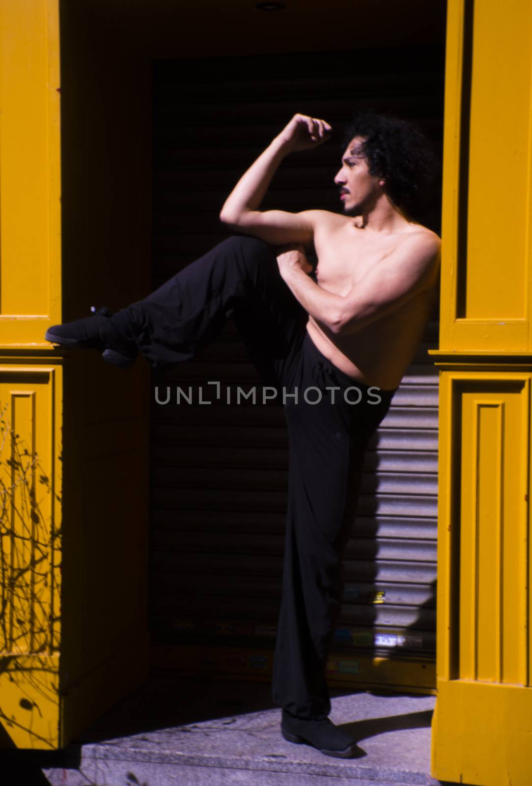 Latin male dancer posing with dancing figures by GemaIbarra