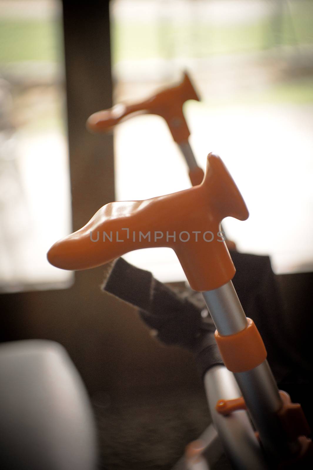 Elderly womans hand resting on her walker