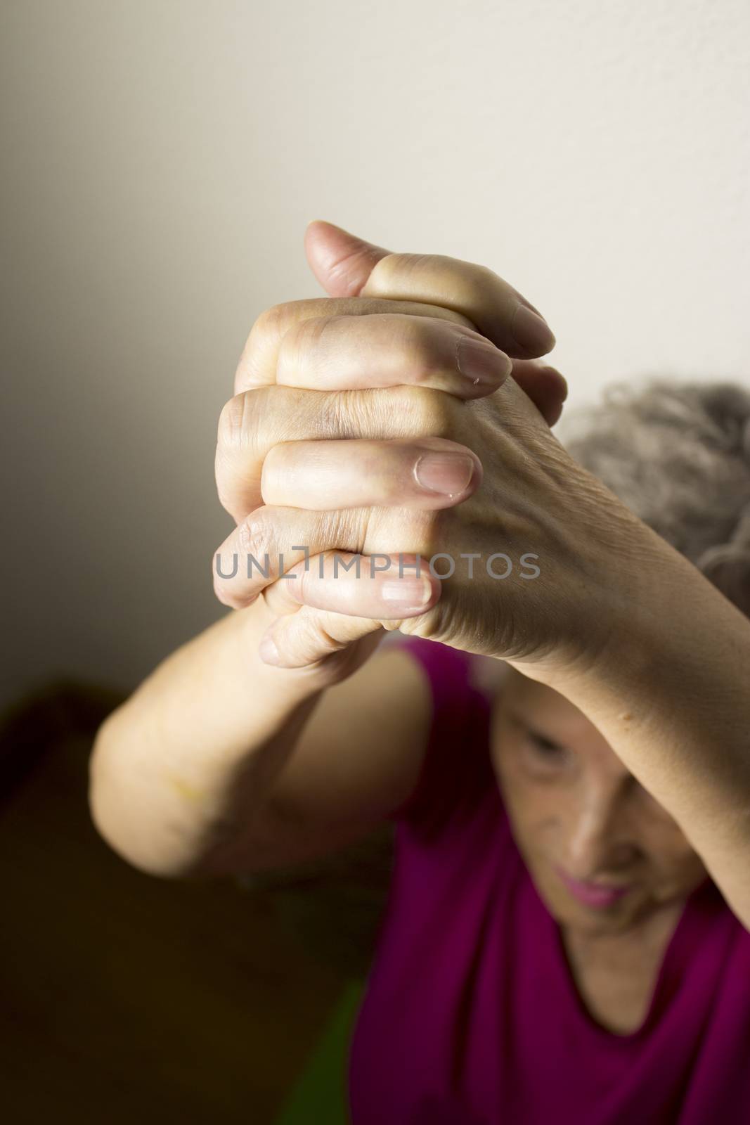 Rehabilitation exercises for an older woman with cerebral stroke