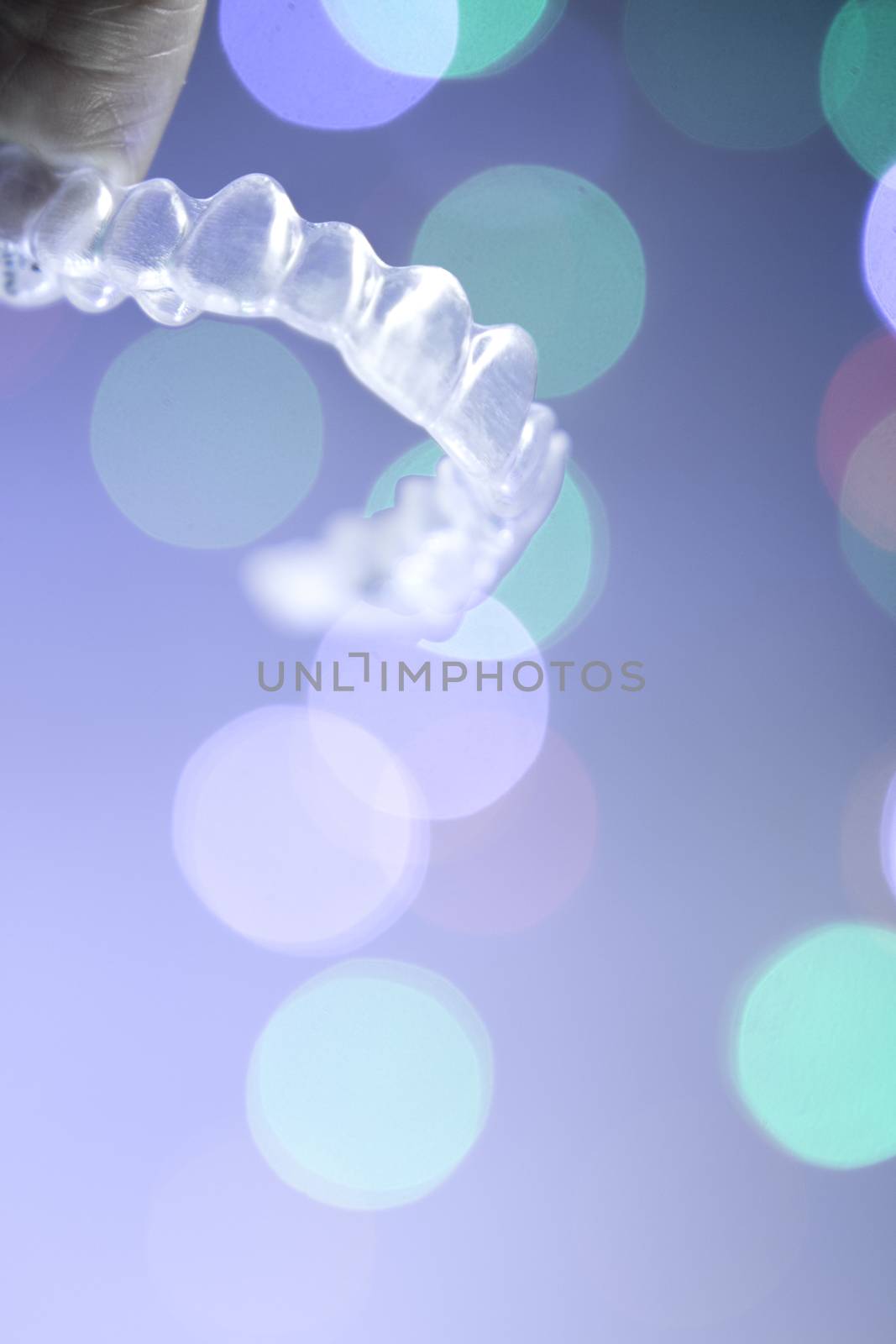 Invisible orthodontics on bokeh background by GemaIbarra
