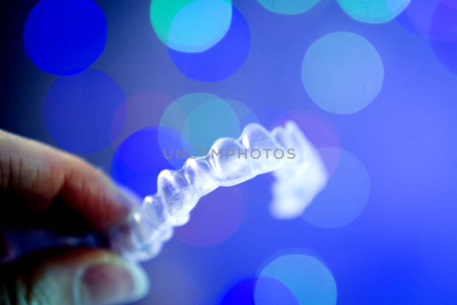 Invisible orthodontics on bokeh background by GemaIbarra