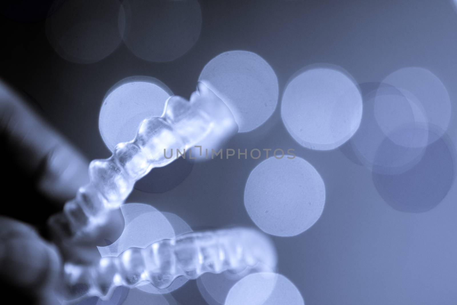 Invisible orthodontics on bokeh background. No people